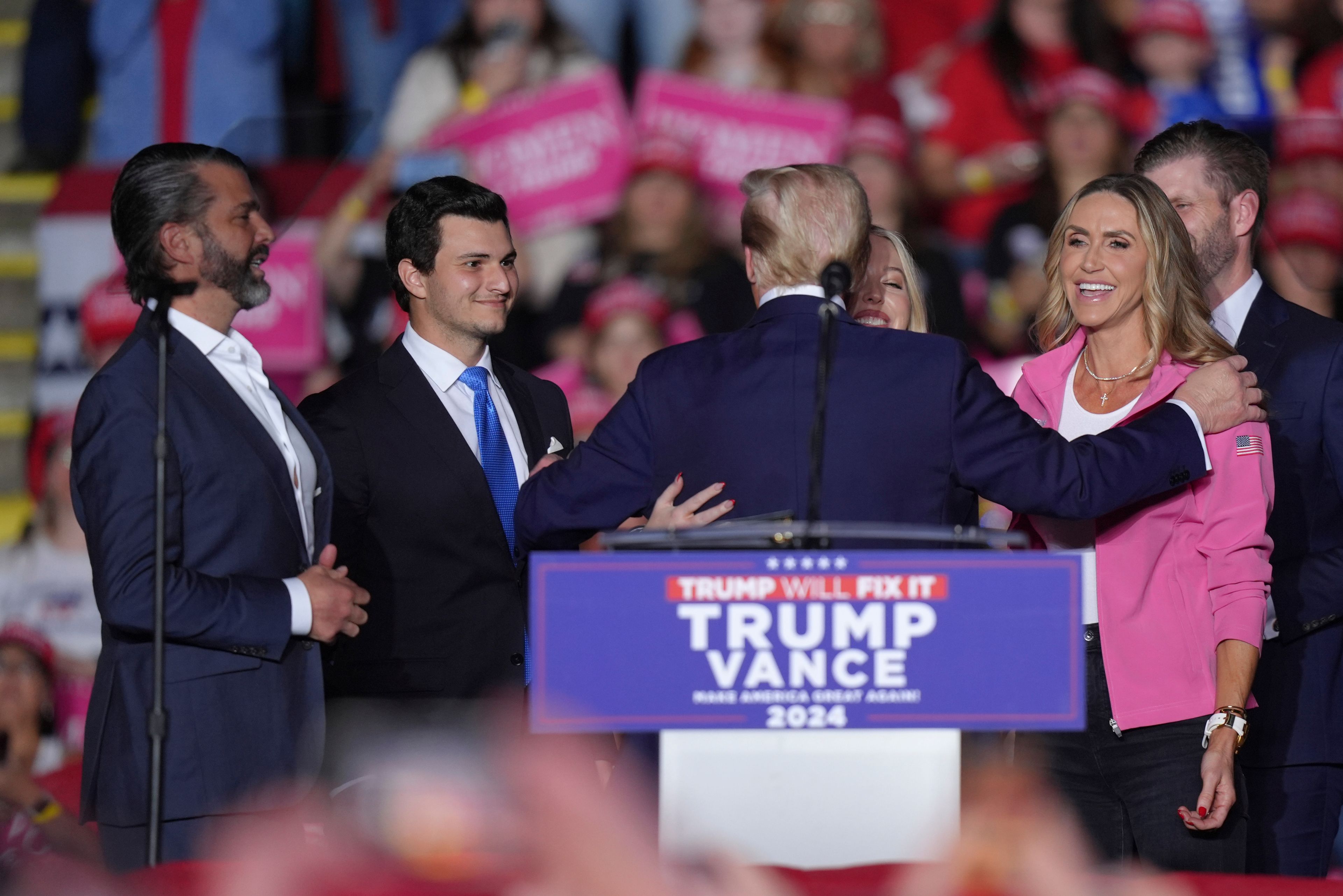 Republican presidential candidate former President Donald Trump, greets, from left, Donald Trump Jr., Michael Boulos, Tiffany Trump, Lara Trump and Eric Trump at a campaign rally, Monday, Nov. 4, 2024, in Reading, Pa. (AP Photo/Chris Szagola)