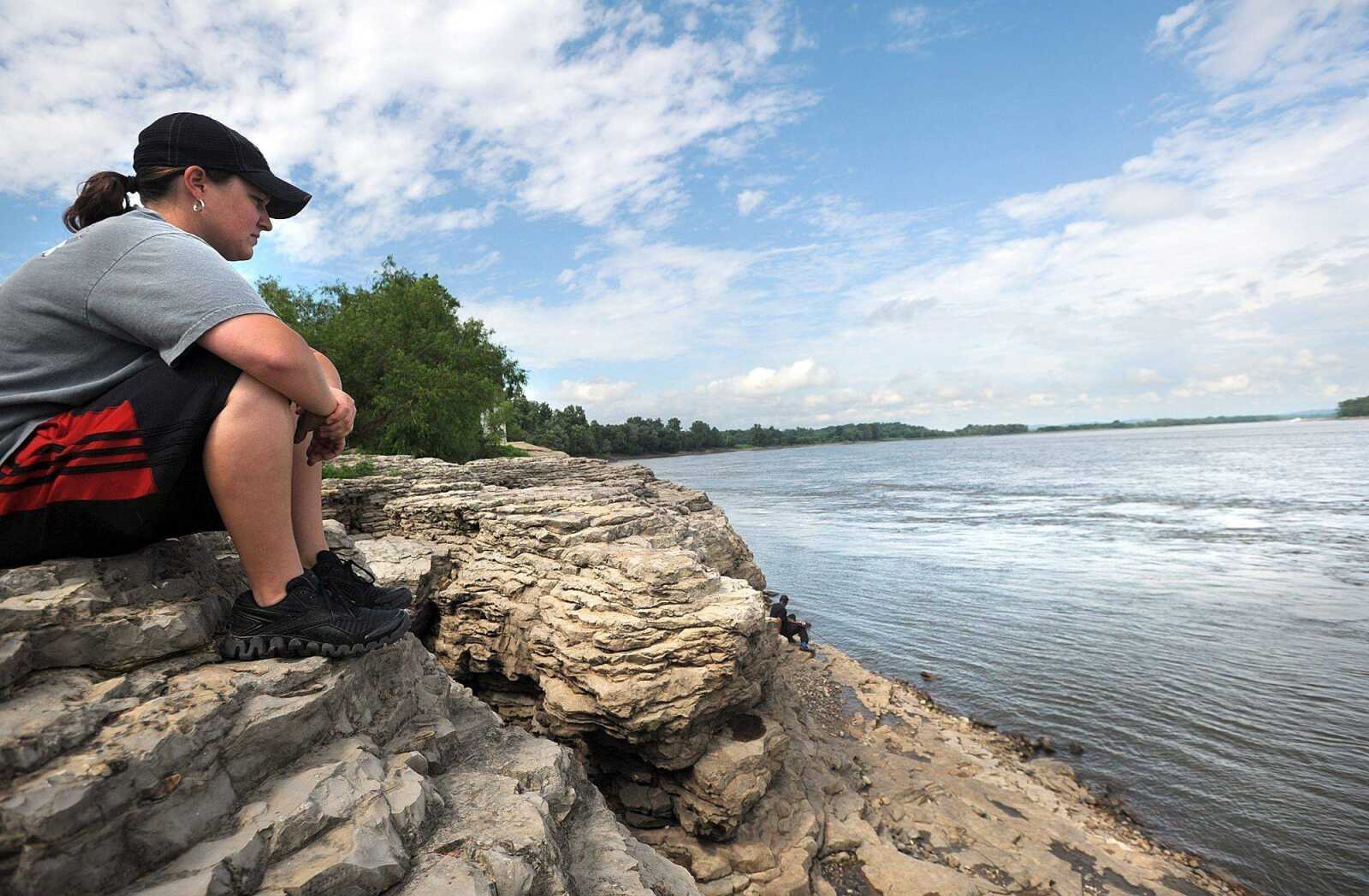 Sarah Dooley takes in the view of the Mississippi River on Tuesday from the bluffs near Cape Rock in Cape Girardeau. &#8220;It&#8217;s very peaceful,&#8221; Dooley said. &#8220;It&#8217;s fun to watch people fish.&#8221; (Laura Simon)