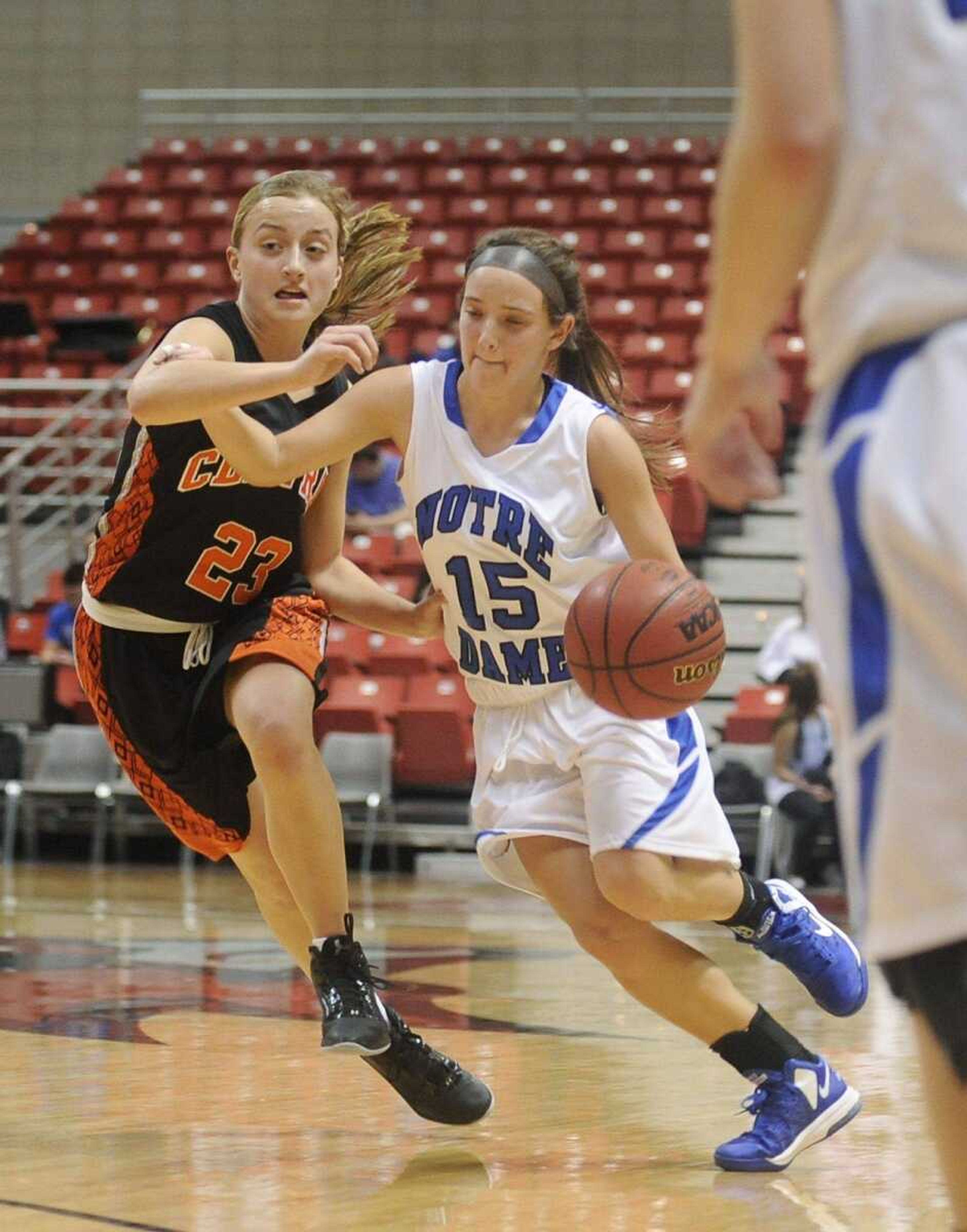 Notre Dame&#8217;s Karsen Powers drives around Central&#8217;s Maddie Daum during the Bulldogs&#8217; 62-35 win over the Tigers on Tuesday at the Show Me Center. (ADAM VOGLER)