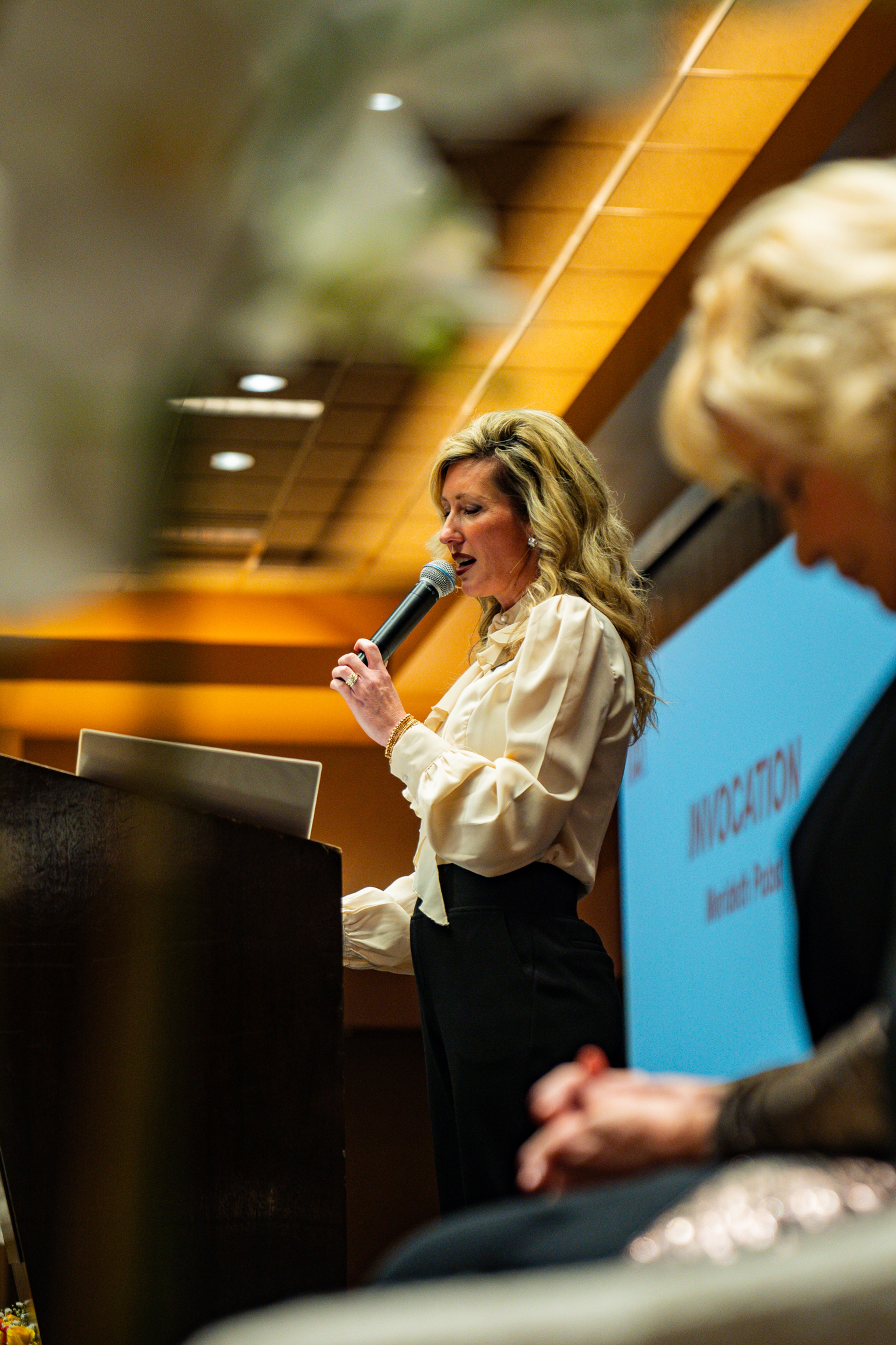 Merideth Pobst gives the invocation for the start of the Zonta Club of Cape Girardeau's Women of Achievement Luncheon and Expo on Friday, Nov. 15 at the Century Casino event center.