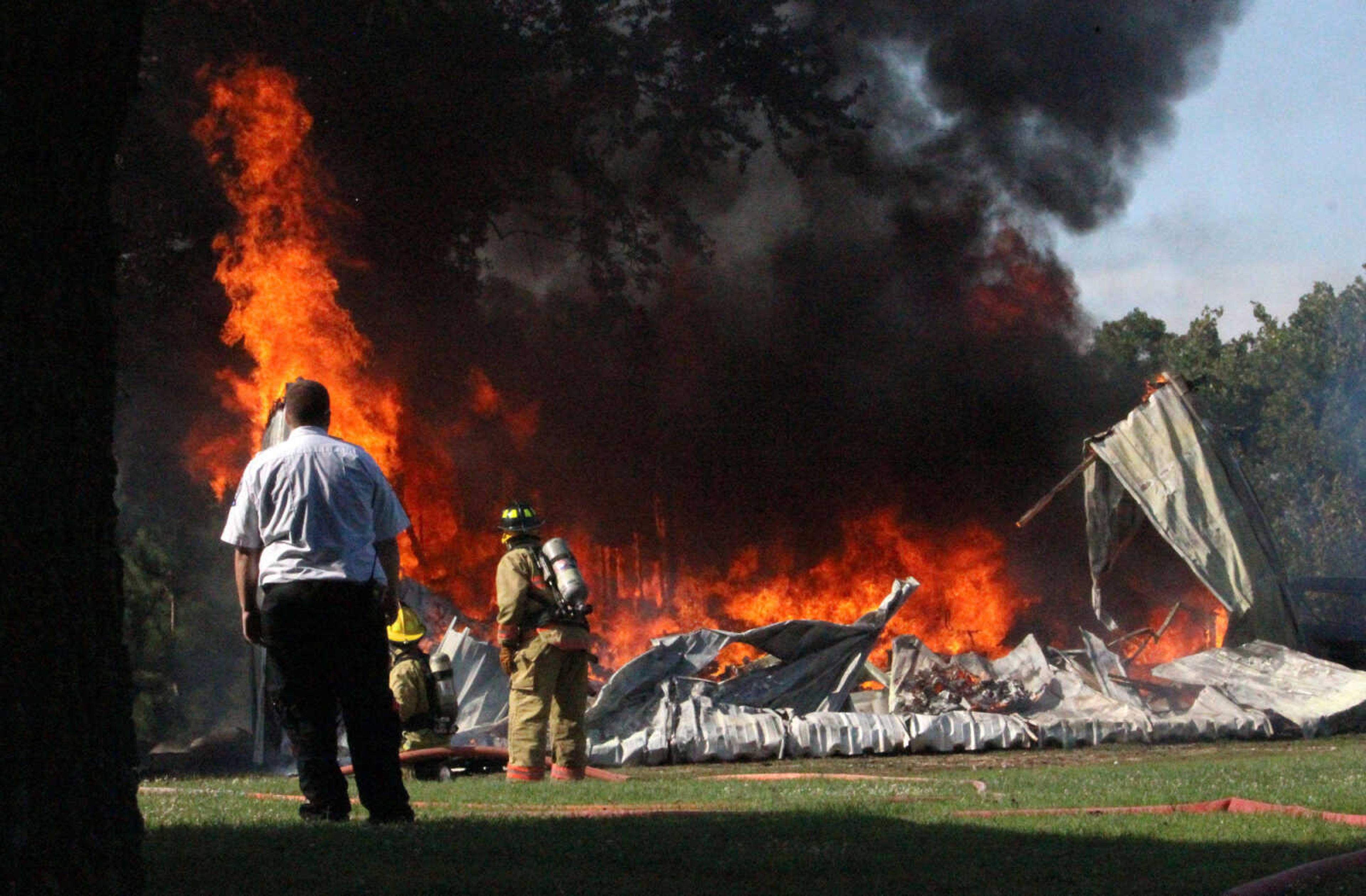 Fire departments responded to a structure fire at 373 Cape Girardeau County Road 319 Friday morning, July 25, 2014. (Mark Blanton)