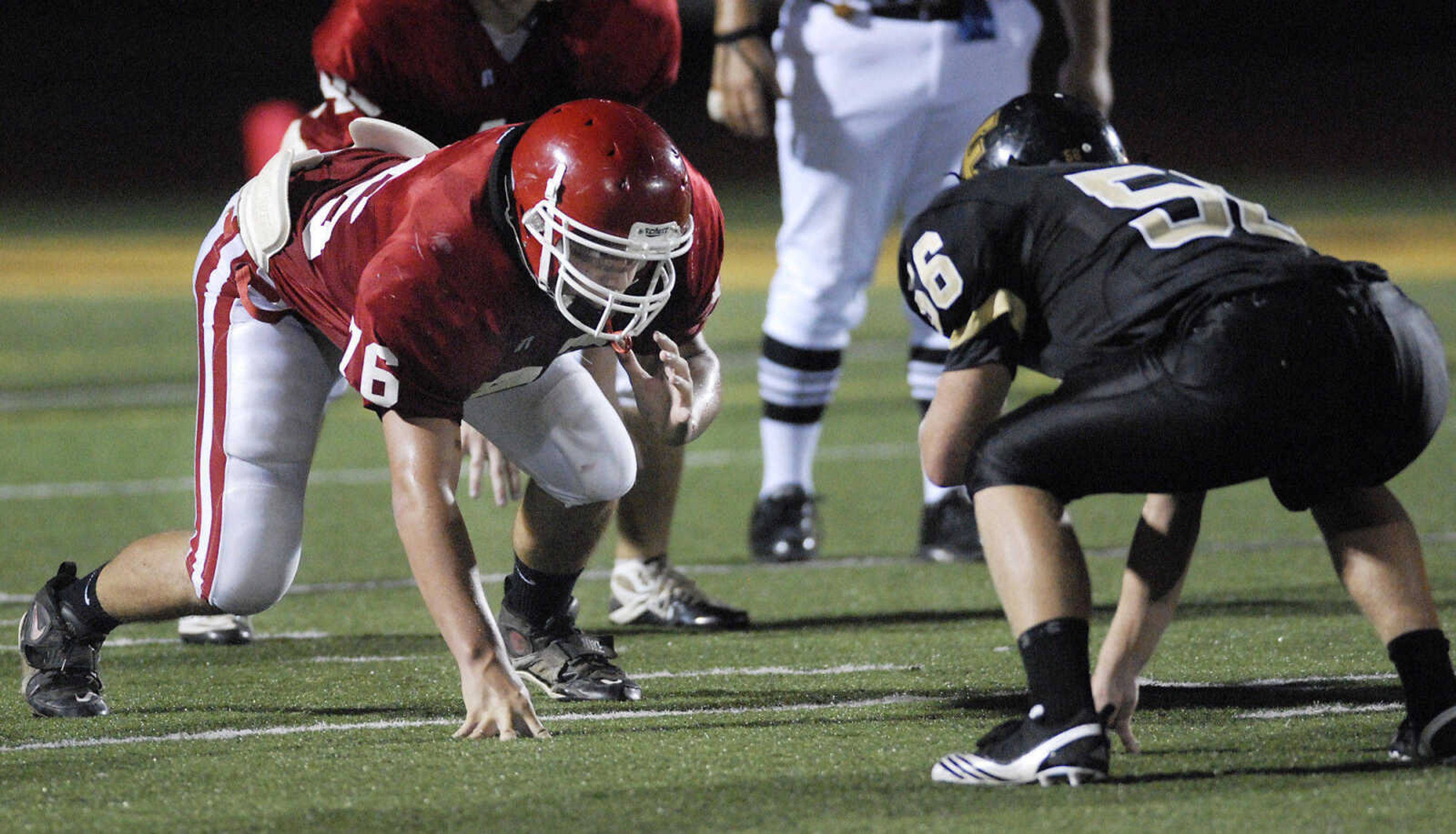 KRISTIN EBERTS ~ keberts@semissourian.com

Jackson's J.T.Payne gets in his stance during a jamboree game against Farmington on Friday, August 20, 2010, at Farmington High School.