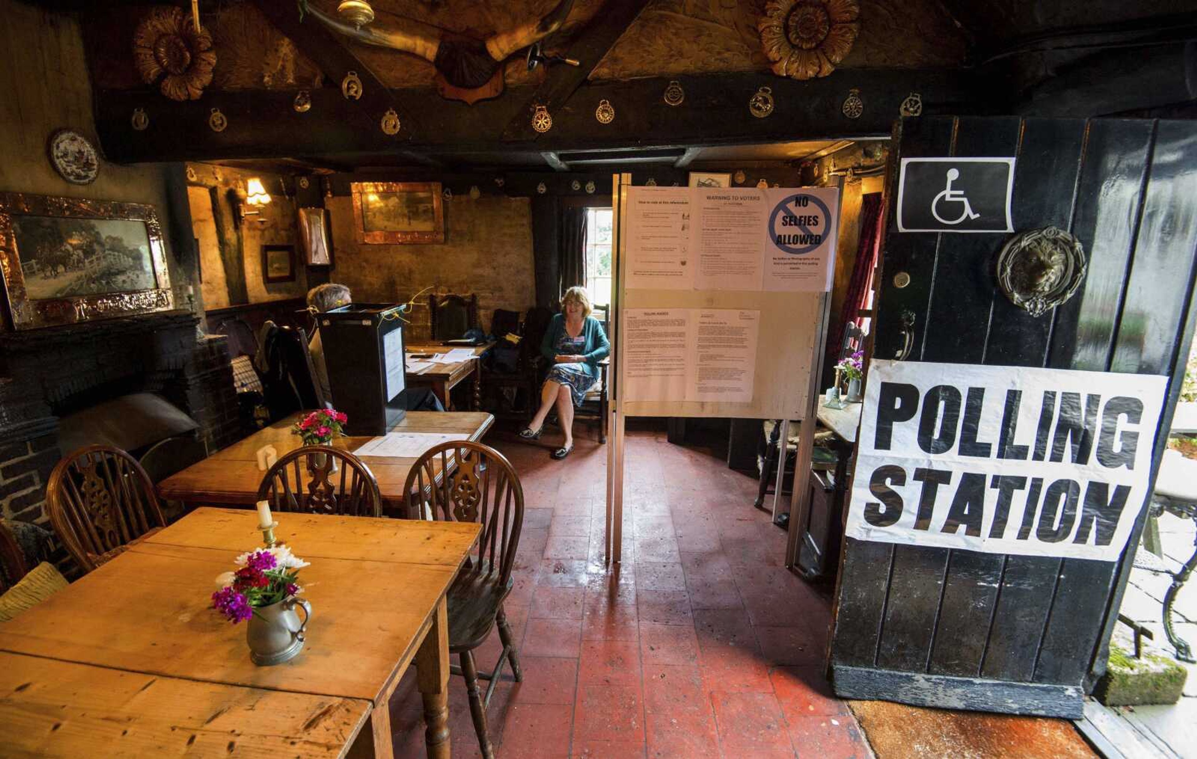 The scene Thursday inside the White Horse Inn in Priors Dean, Hampshire, England, also known as the "Pub with no name," which had been made a polling station for the EU referendum.