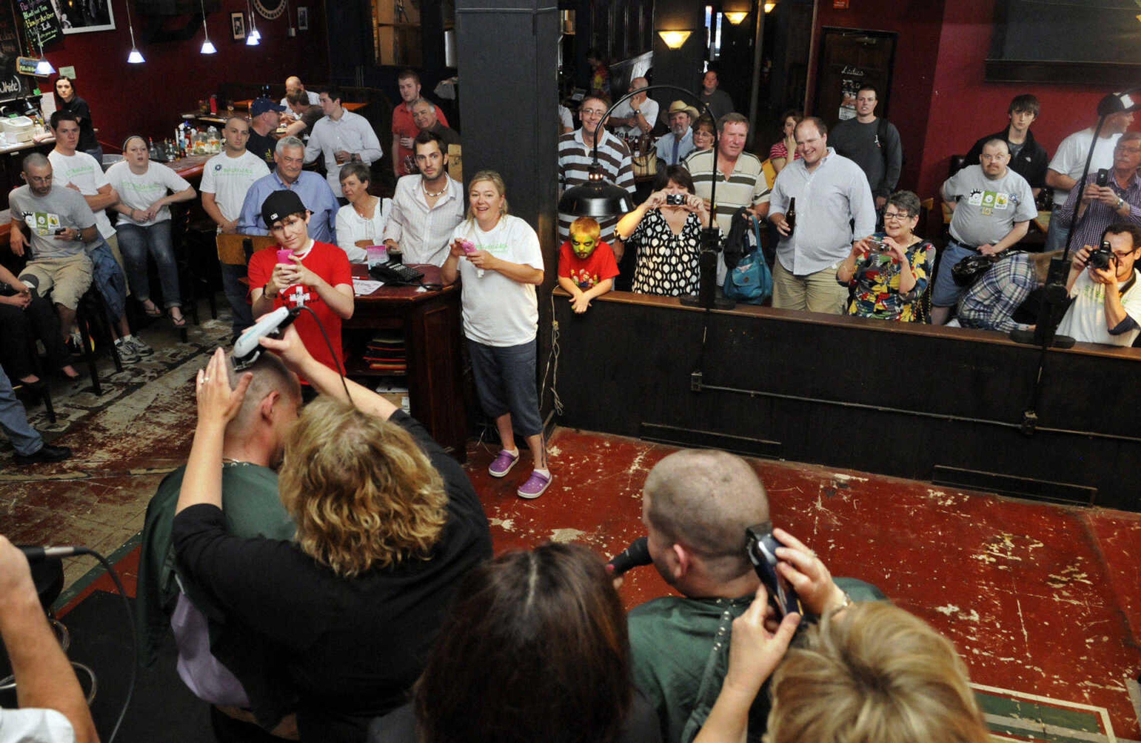 KRISTIN EBERTS ~ keberts@semissourian.com

Spectators pack Buckner Brewing Company in Cape Girardeau, Mo., during the St. Baldrick's event on Saturday, April 24, 2010. The twenty-five area participants in the event raised over $9,000 collectively before shaving their heads in front of family and friends to benefit the St. Baldrick's Foundation for child cancer research.