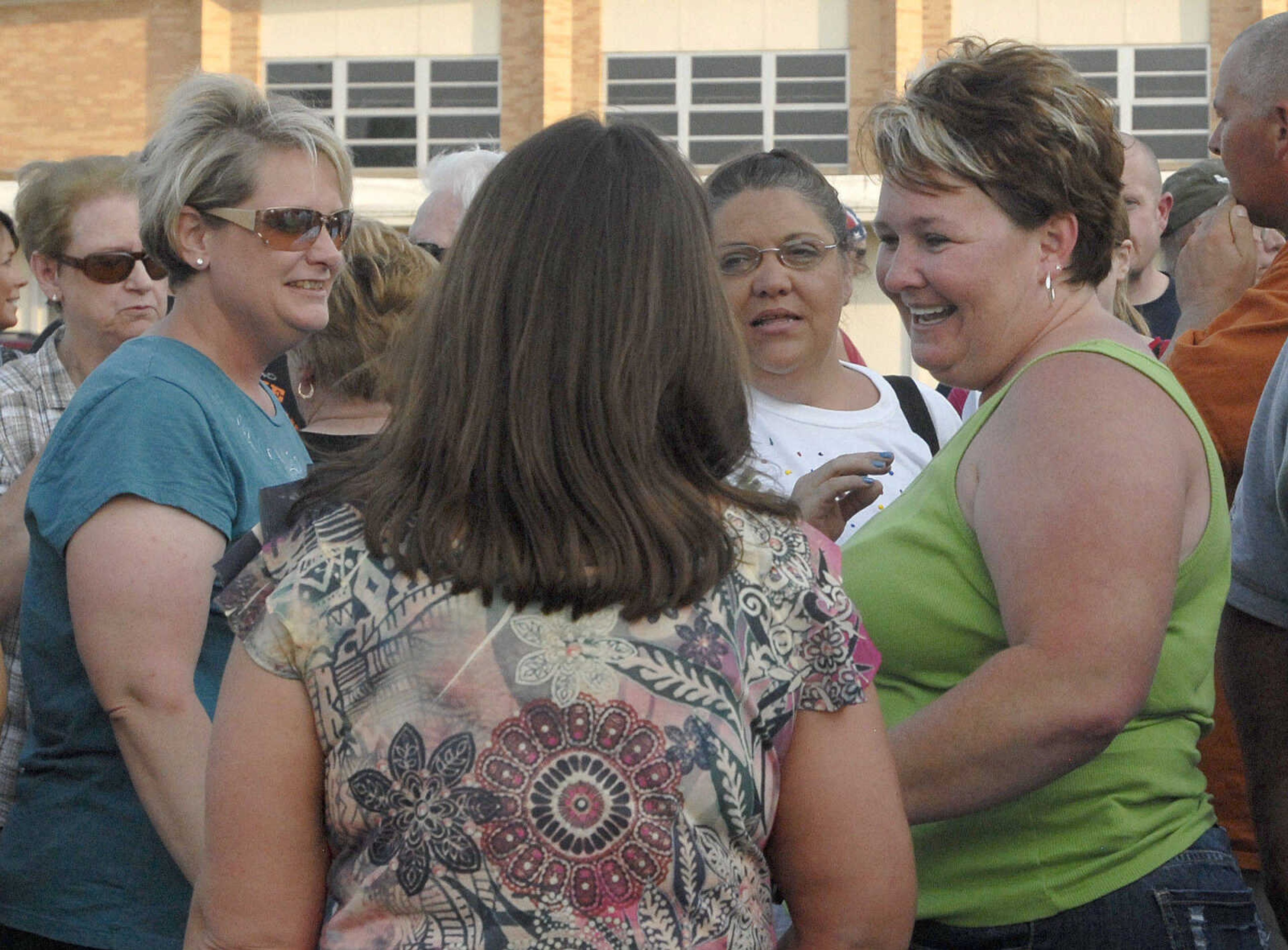 LAURA SIMON~lsimon@semissourian.com
Friends and family of Jacque Sue Waller visit with Waller's sister Cheryl Brenneke, right, Thursday, June 9, 2011 during a prayer service for Waller at Farmington High School. Waller, a 39-year-old mother of three, has been missing since June 1, 2011.