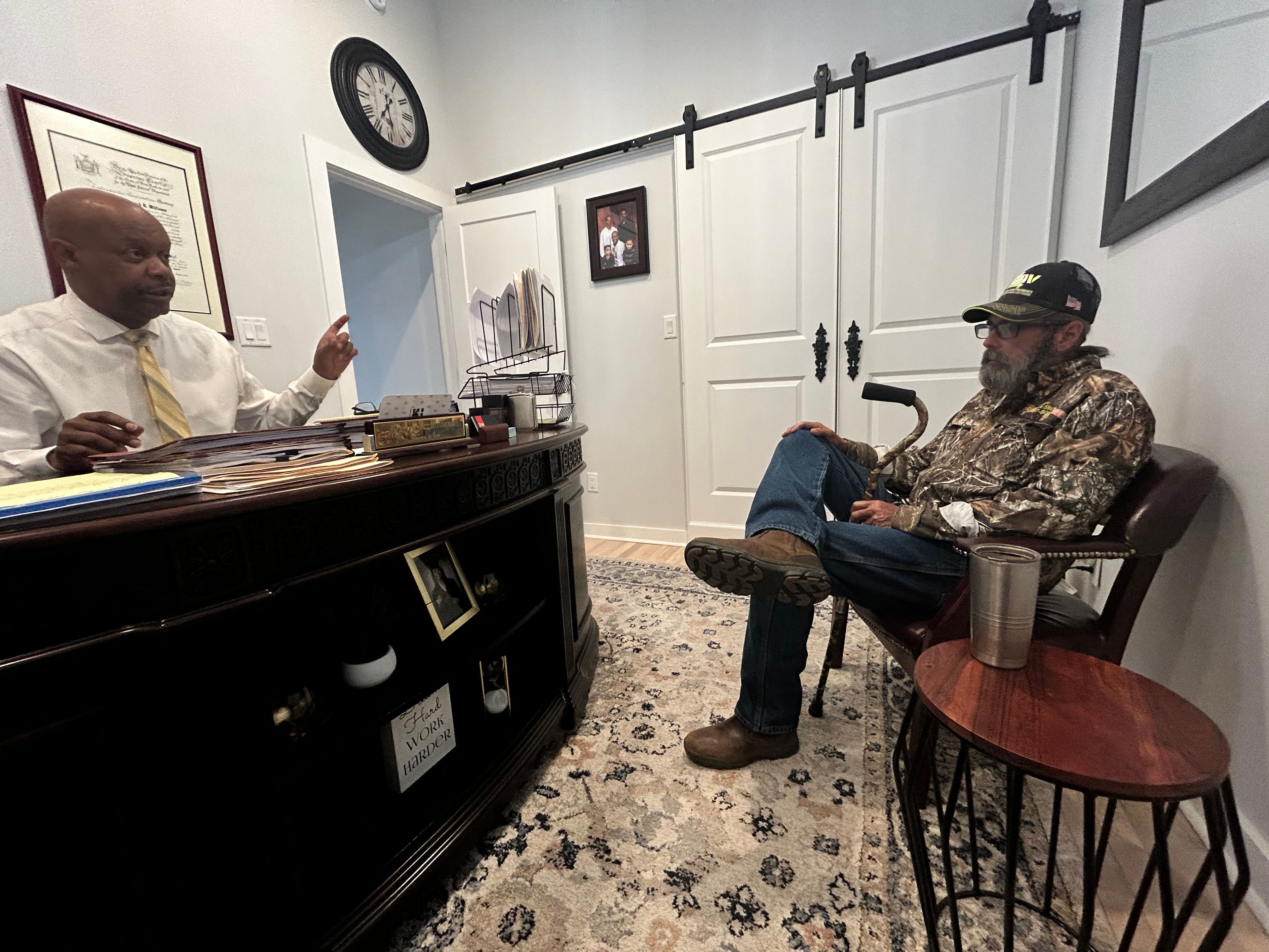 Attorney Derrick Williams and Robert Teater talk to a reporter about Teater's case in November 2023 before Teater accepted a $95,000 settlement from the city of Cape Girardeau regarding accusations of excessive force by police officers.