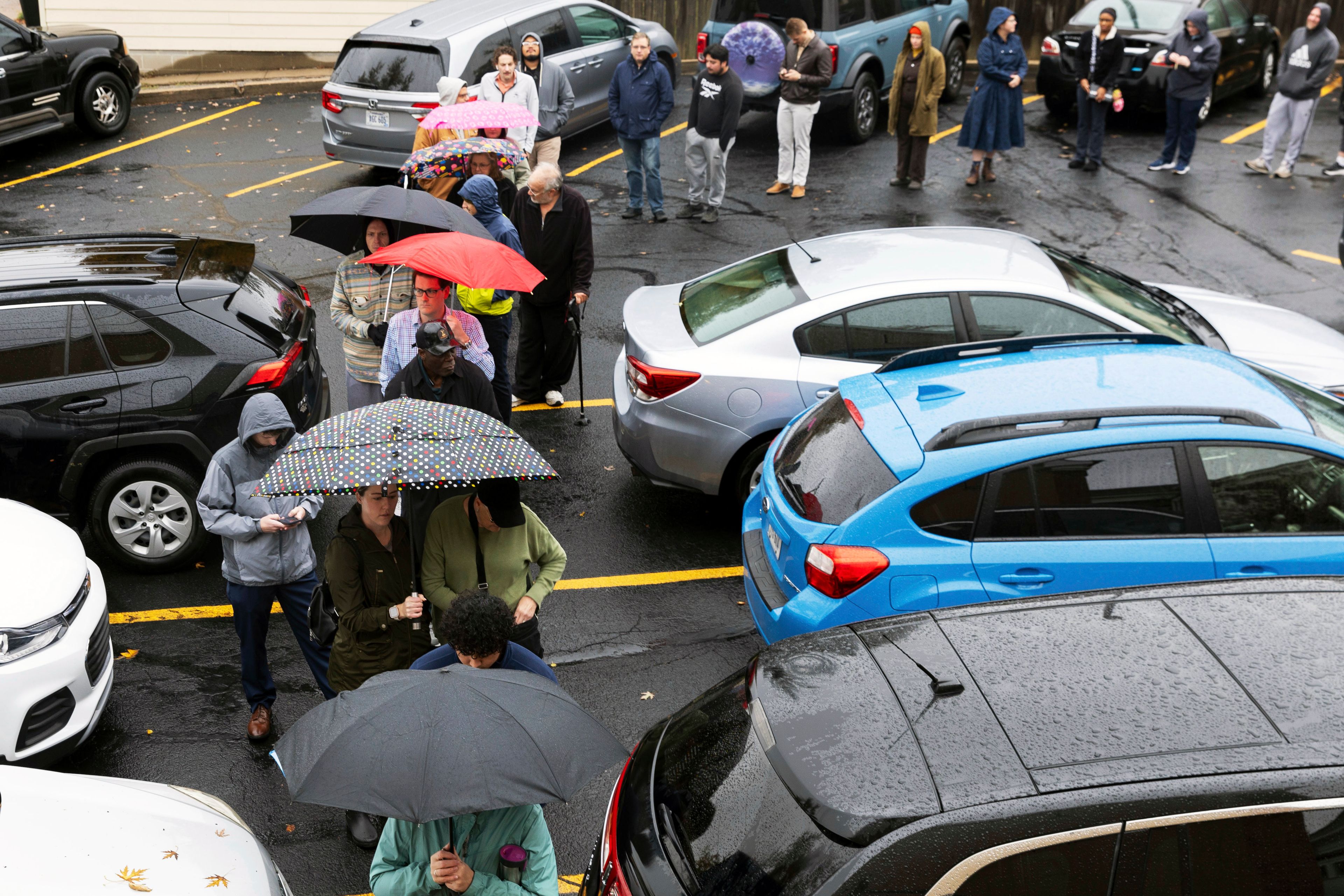 People line up to vote outside a polling station at Bethel Lutheran Church in Omaha, Neb., on Election Day, Tuesday, Nov. 5, 2024. (Chris Machian/Omaha World-Herald via AP)