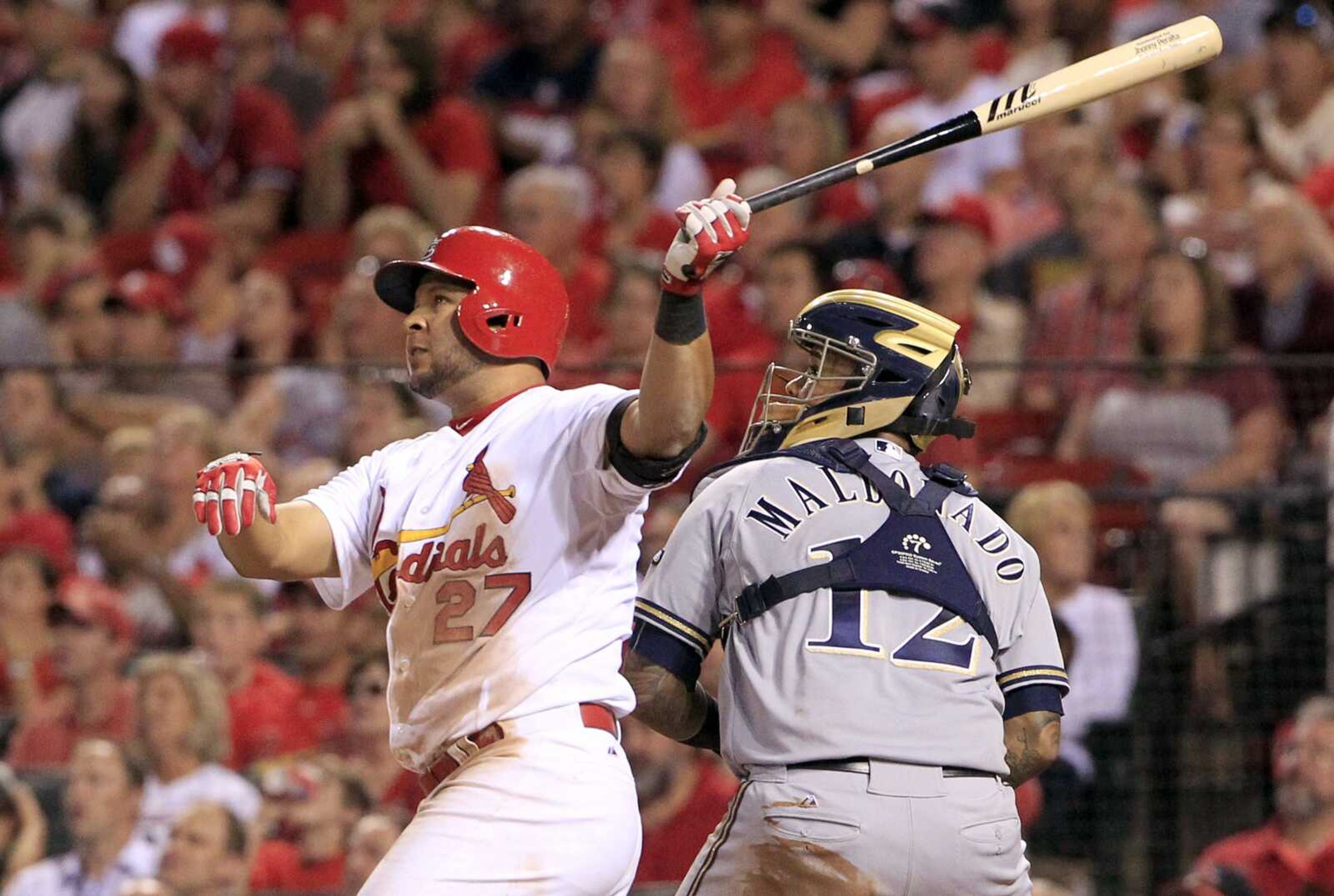 St. Louis Cardinals  Jhonny Peralta watches his three-run home run along side Milwaukee Brewers catcher Martin Maldonado during the fourth inning of a baseball game on Thursday, Sept. 24, 2015, in St. Louis. (AP Photo/Jeff Roberson)