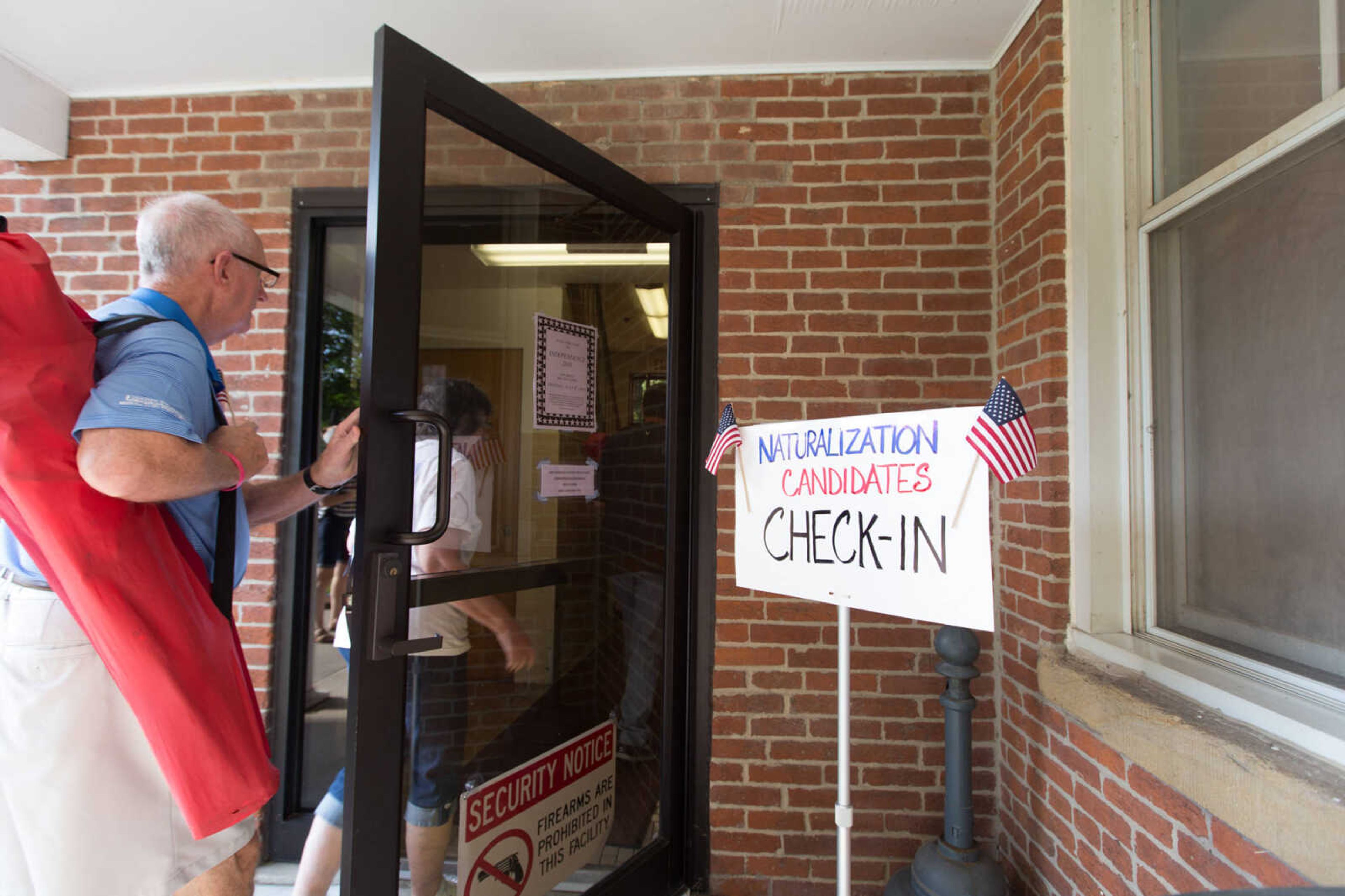 GLENN LANDBERG ~ glandberg@semissourian.com


A crowd moves into the Common Pleas Courthouse in Cape Girardeau for a naturalization ceremony Monday, July 4, 2016.