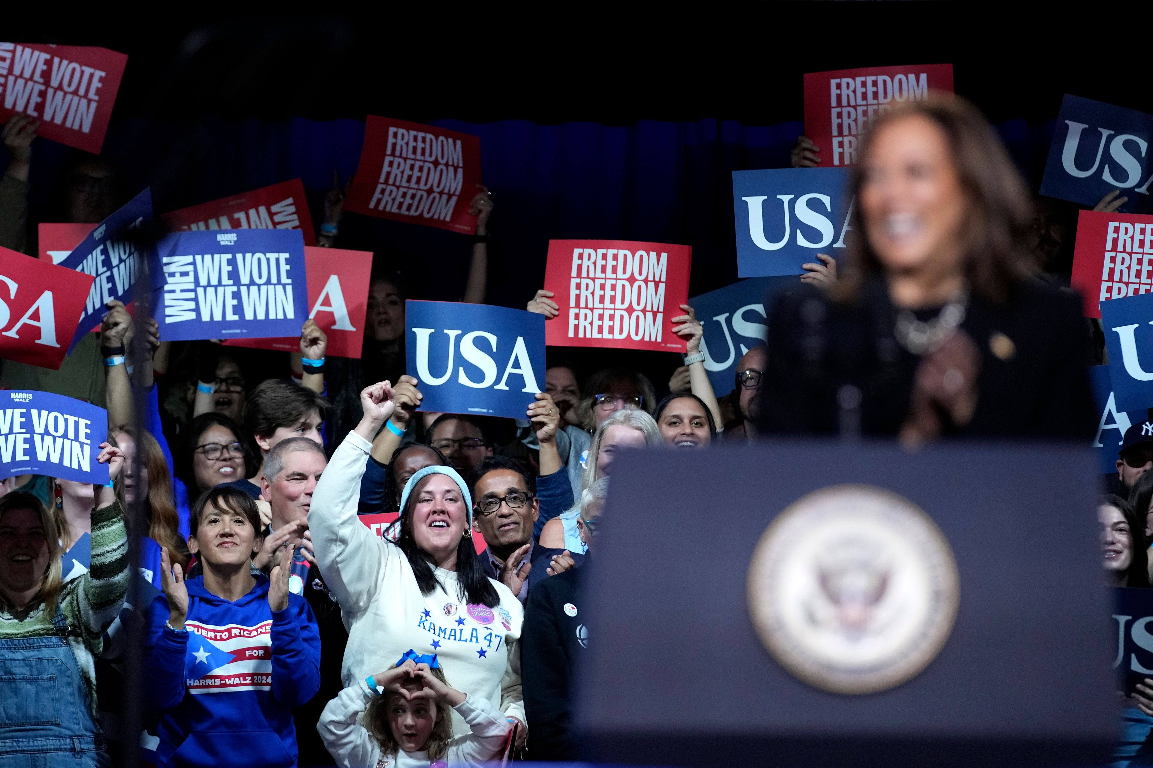 Supporters cheer as Democratic presidential nominee Vice President Kamala Harris speaks during a campaign rally in Memorial Hall at Muhlenberg College in Allentown, Pa., Monday, Nov. 4, 2024. (AP Photo/Susan Walsh)