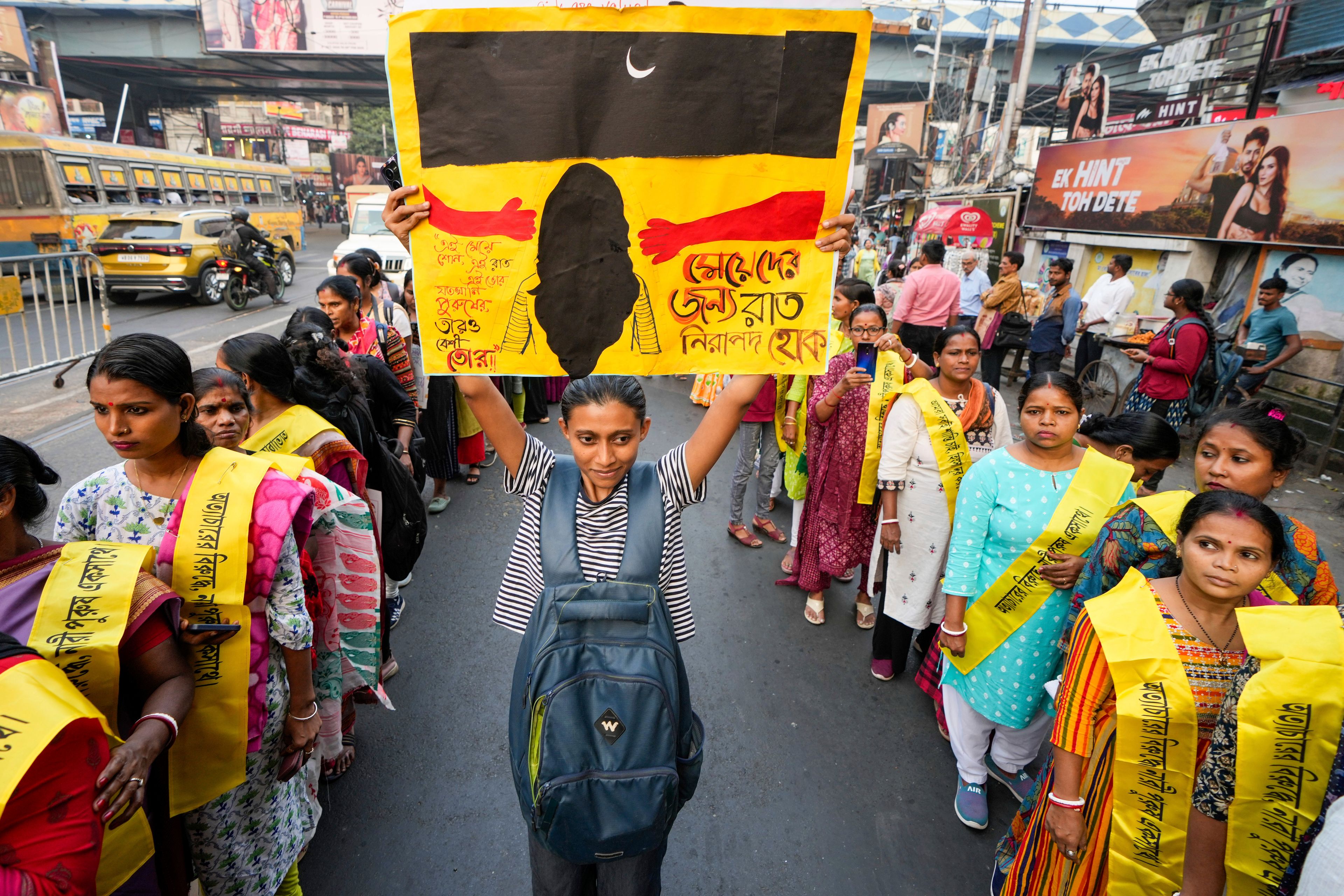 Activists from different non-government organisations shout slogans as they stage a rally to mark the International Day for the Elimination of Violence against Women, in Kolkata, India, Monday, Nov. 25, 2024. Poster in the middle read in Bangla, let the nights be safe for women. (AP Photo/Bikas Das)