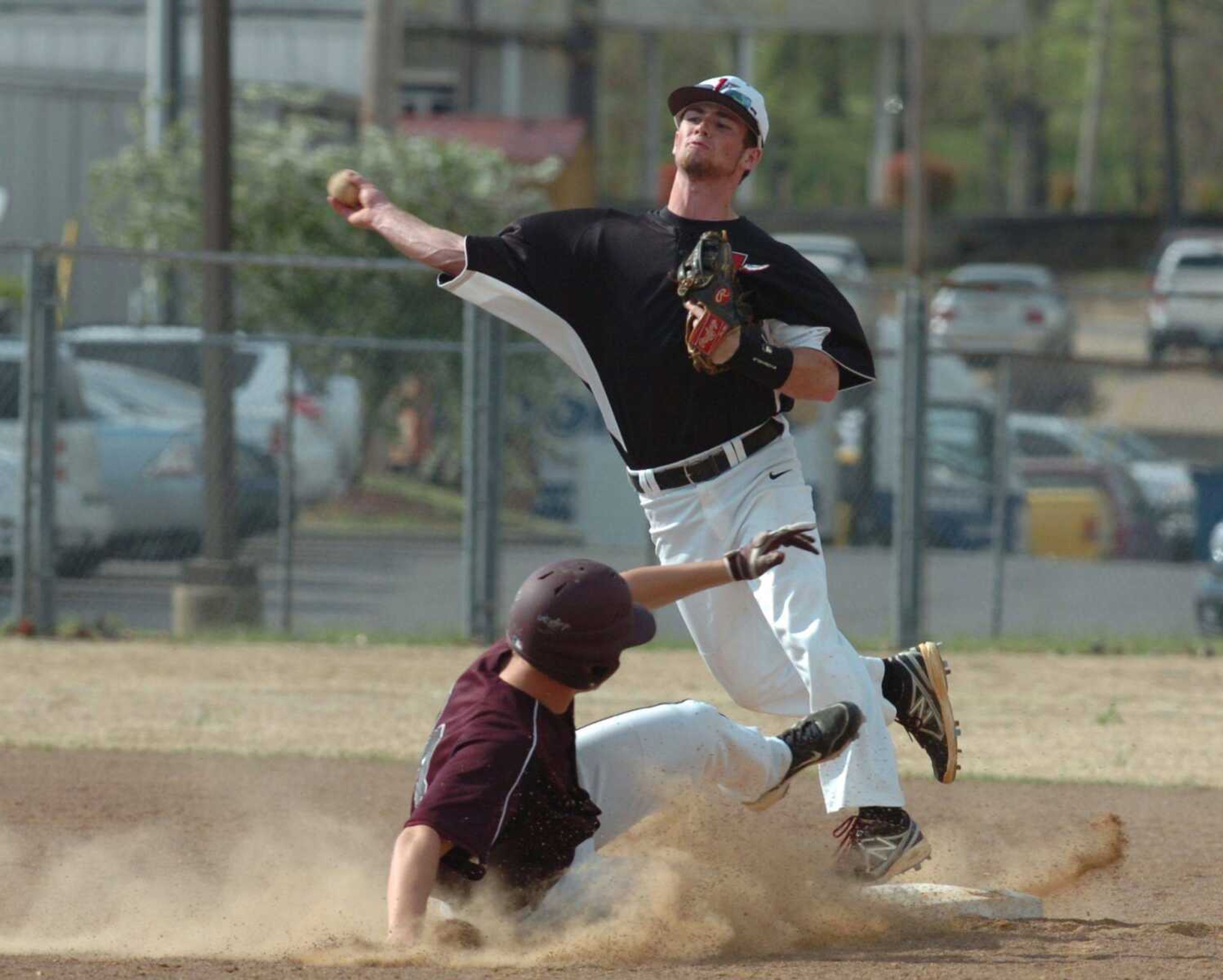 Jackson second baseman Ryan O&#8217;Rear throws to first after forcing out courtesy runner Cody Slusher in the third inning of the Indians&#8217; 4-1, 14-inning win at Poplar Bluff. (Brian Rosener ~ Daily American Republic)