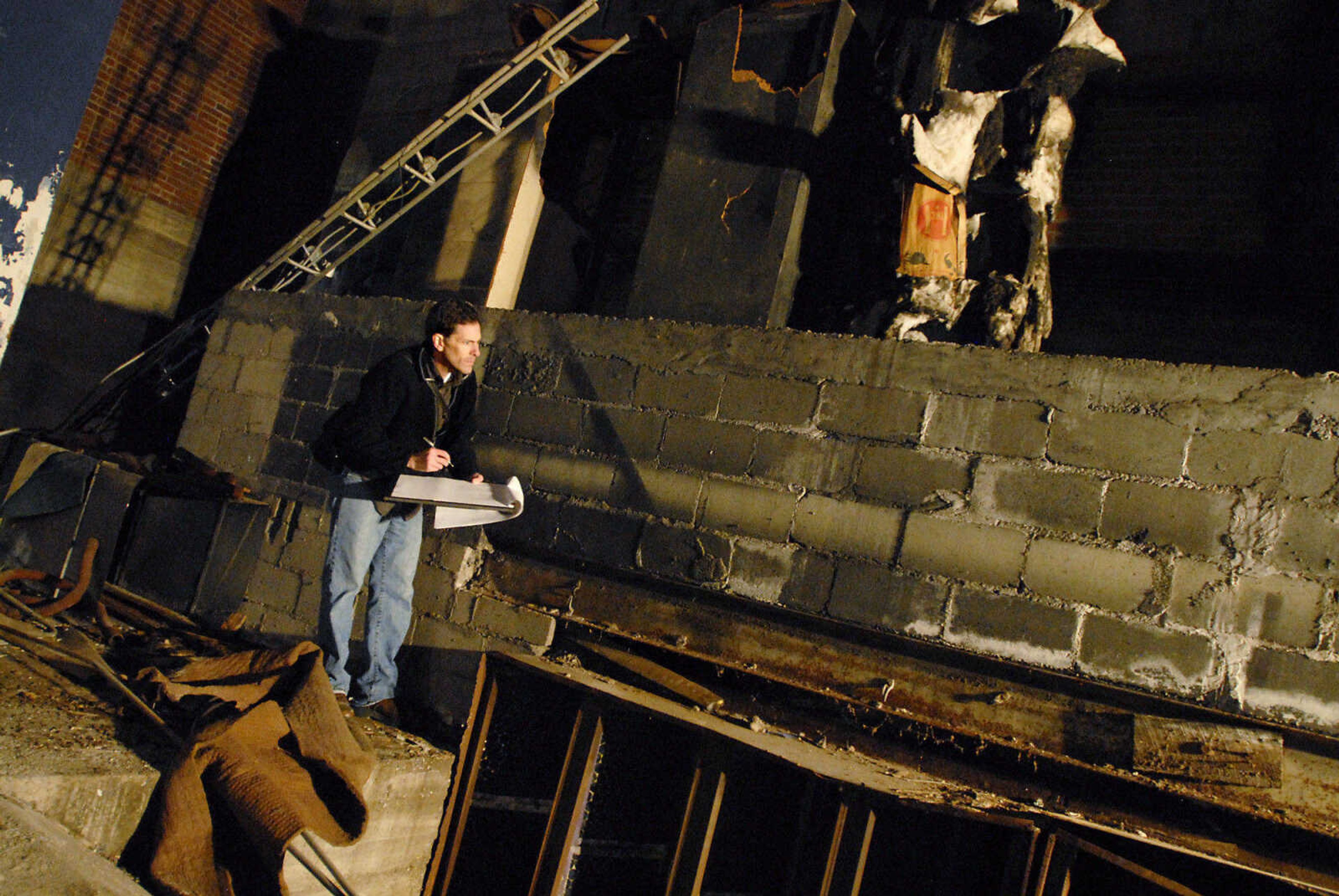 KRISTIN EBERTS ~ keberts@semissourian.com

David Leavey, of Kiku Obata & Company, works to take measurements of the Esquire Theater building on Friday, Jan. 6, 2012, in Cape Girardeau. Renovation work on the Esquire Theater continues as workers from Kiku Obata & Company and Penzel Construction complete field verification work and take measurements necessary for the design plans.