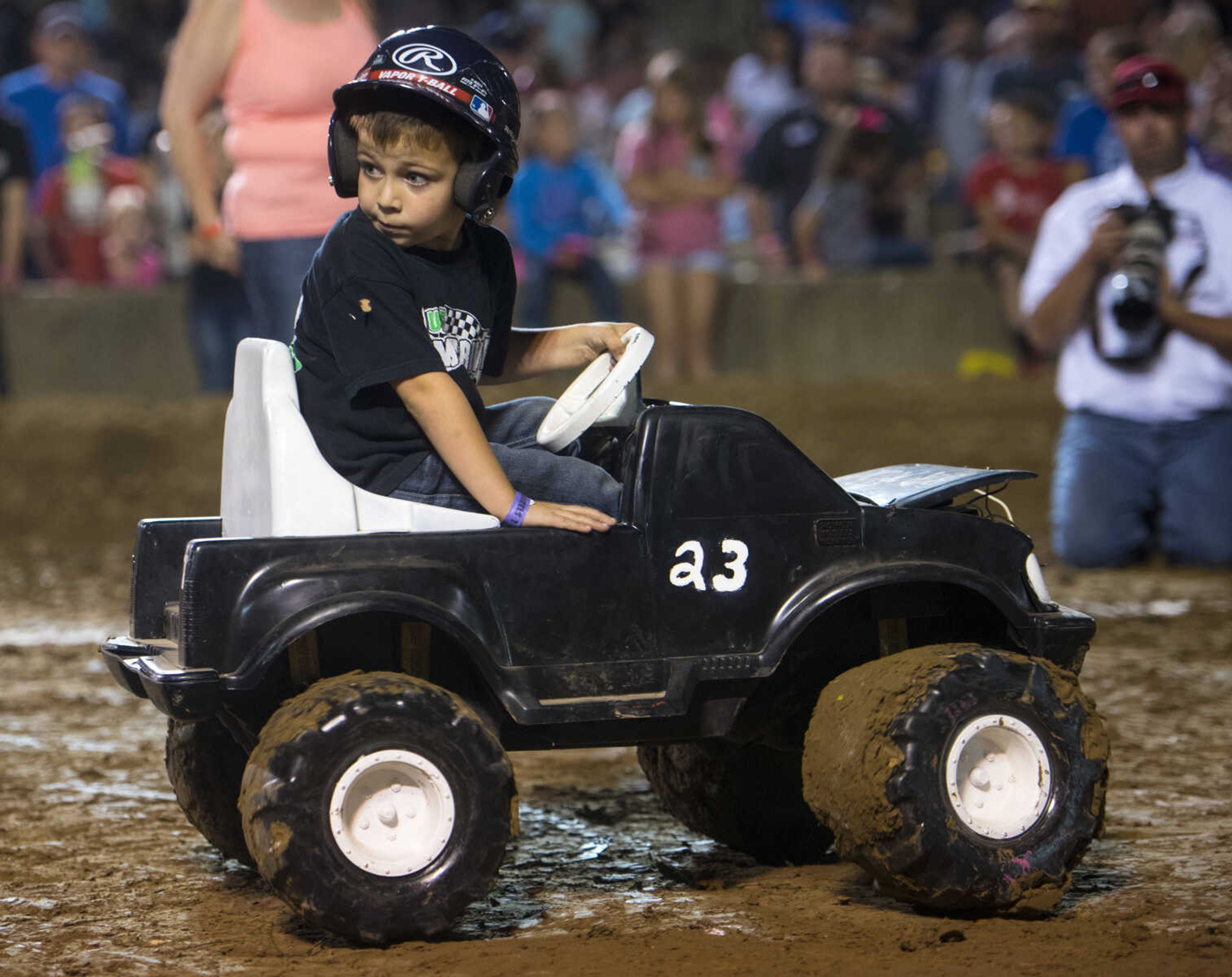 Children drive in a children's event in the Auto Tire & Parts Dual Demo Derby September 9, 2017, at the SEMO District Fair in Cape Girardeau.