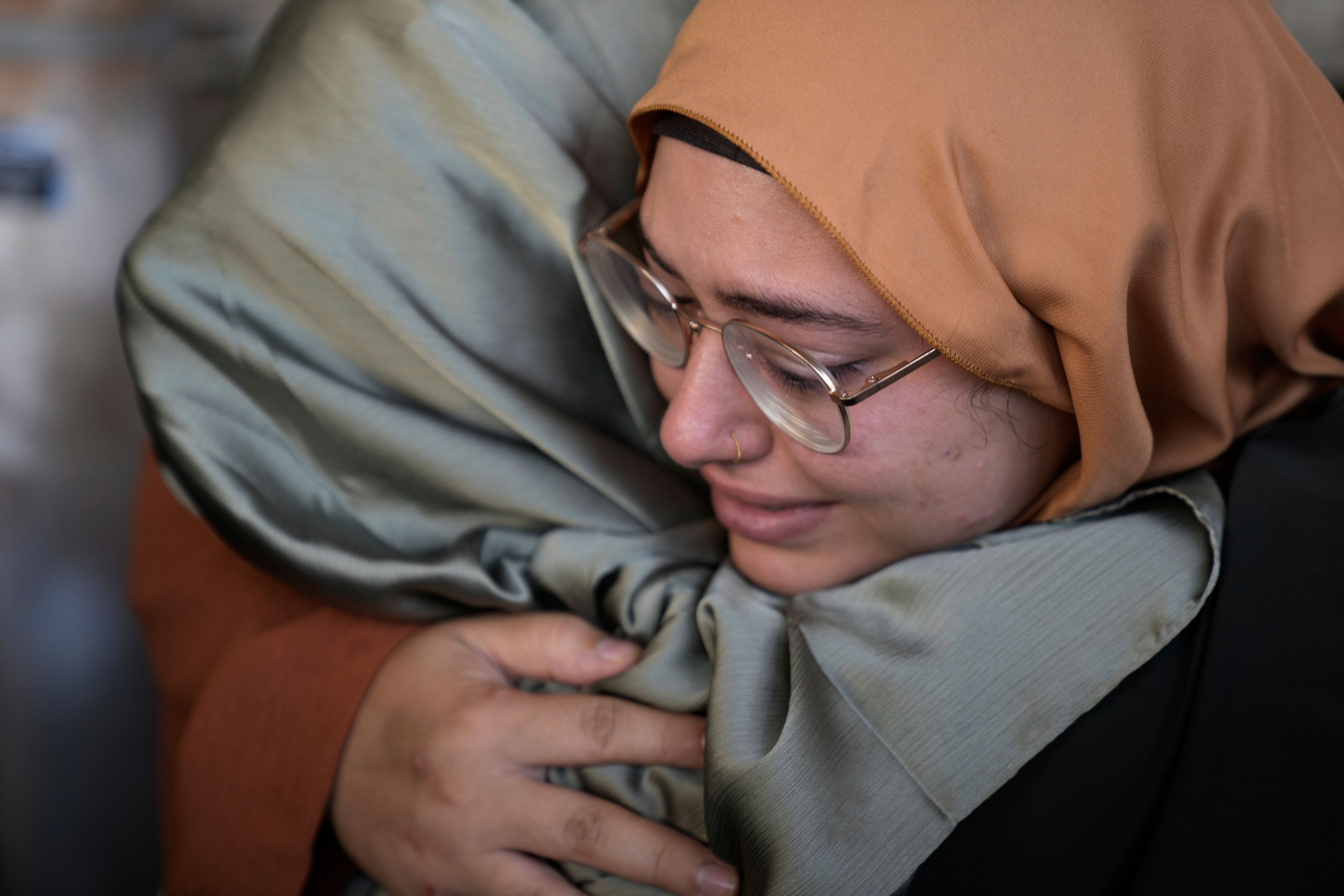 Activists react next to the body of Turkish-American Aysenur Ezgi Eygi at the hospital morgue in Nablus, West Bank, Sunday, Sept. 8, 2024. Eygi, 26, died after being shot in the head on Friday, Palestinian doctors said. Witnesses to the shooting said the was fatally shot by Israeli forces in a moment of calm after clashes between Palestinians and Israeli forces in the northern West Bank. (AP Photo/Majdi Mohammed)