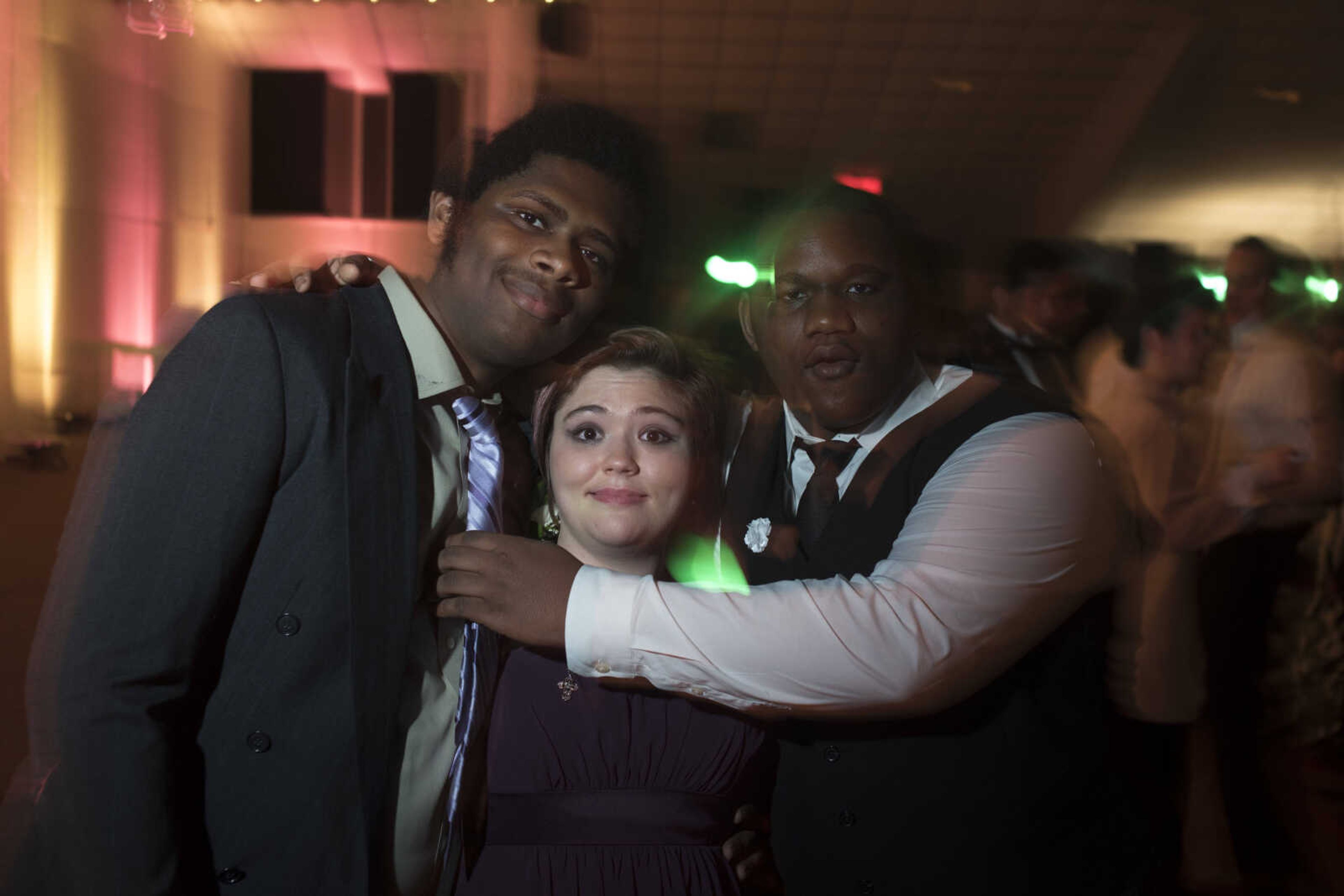 From left, Brandin Wilkerson, Katrina Strouth, and Tim Dickison pose for a photo on the dance floor during Cape Central High School Prom Saturday, April 27, 2019, at Ray's Banquet Center in Cape Girardeau.