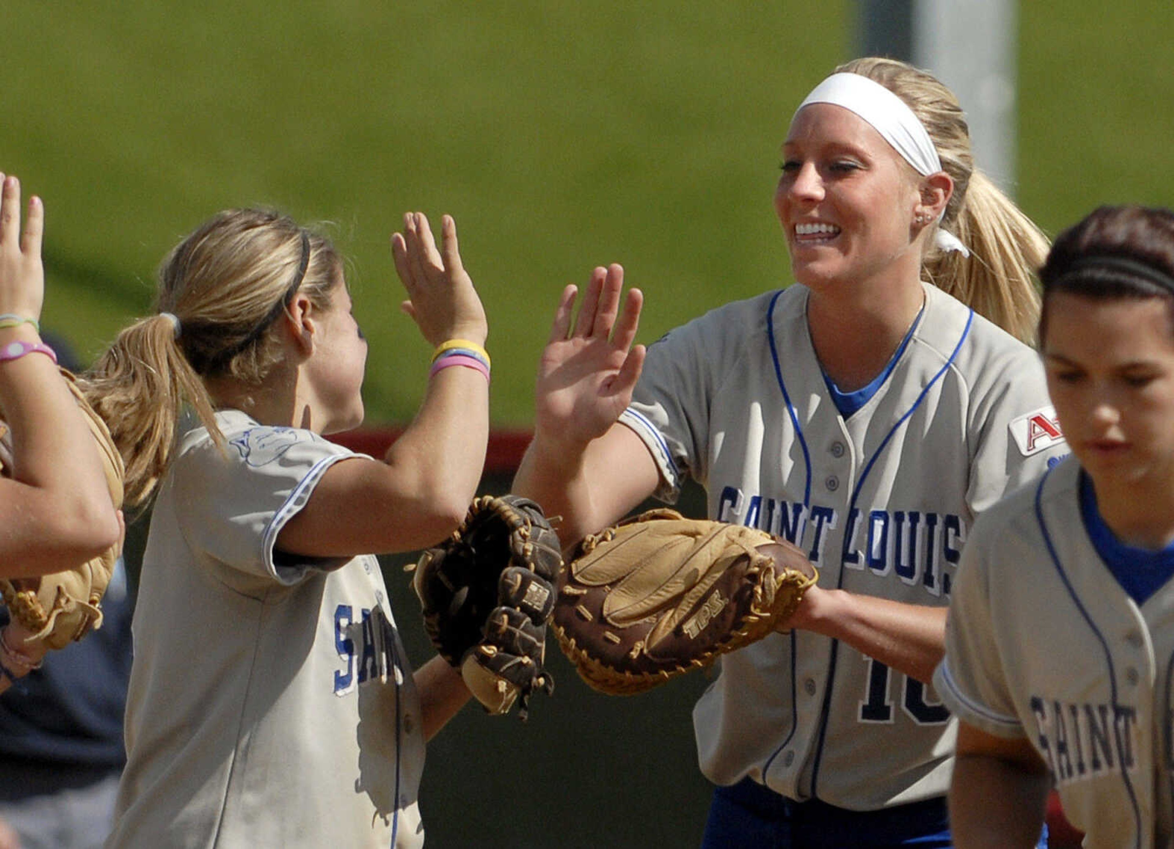 LAURA SIMON~lsimon@semissourian.com
Saint Louis University first baseman Kristain Burger high-fives her teammates in the fourth inning during the first game of a double-header against Southeast Missouri State Wednesday, May 4, 2011 at the Southeast Softball Complex.