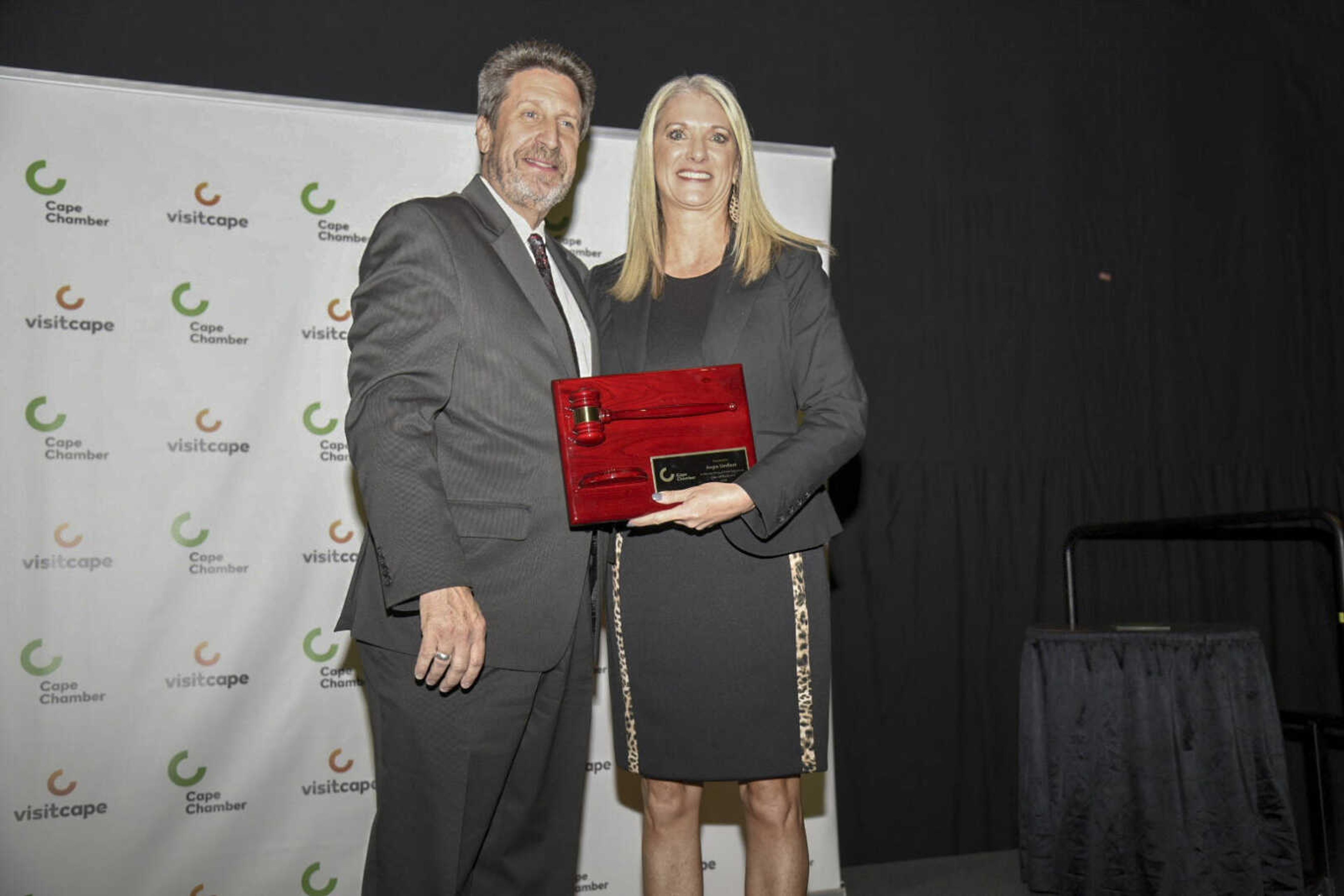 Angie Umfleet accepts a recognition of her services as Chair of the Board during the 2021 Annual Cape Chamber Dinner Thursday, Oct. 21, at the Show Me Center in Cape Girardeau.