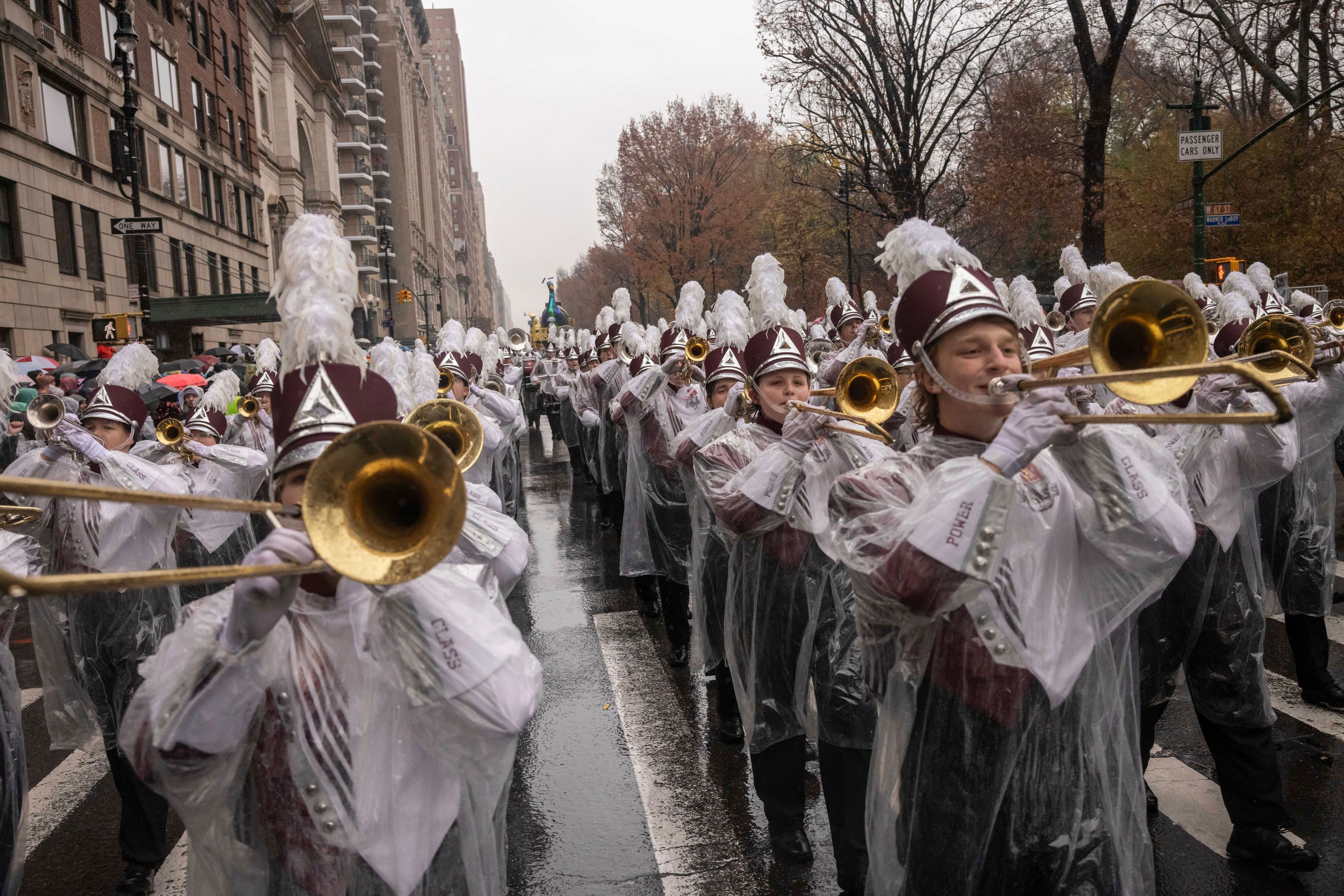 Members of University of Massachusetts Minutemen marching band march along Central Park West during the Macy's Thanksgiving Day parade, Thursday, Nov. 28 2024, in New York. (AP Photo/Yuki Iwamura)