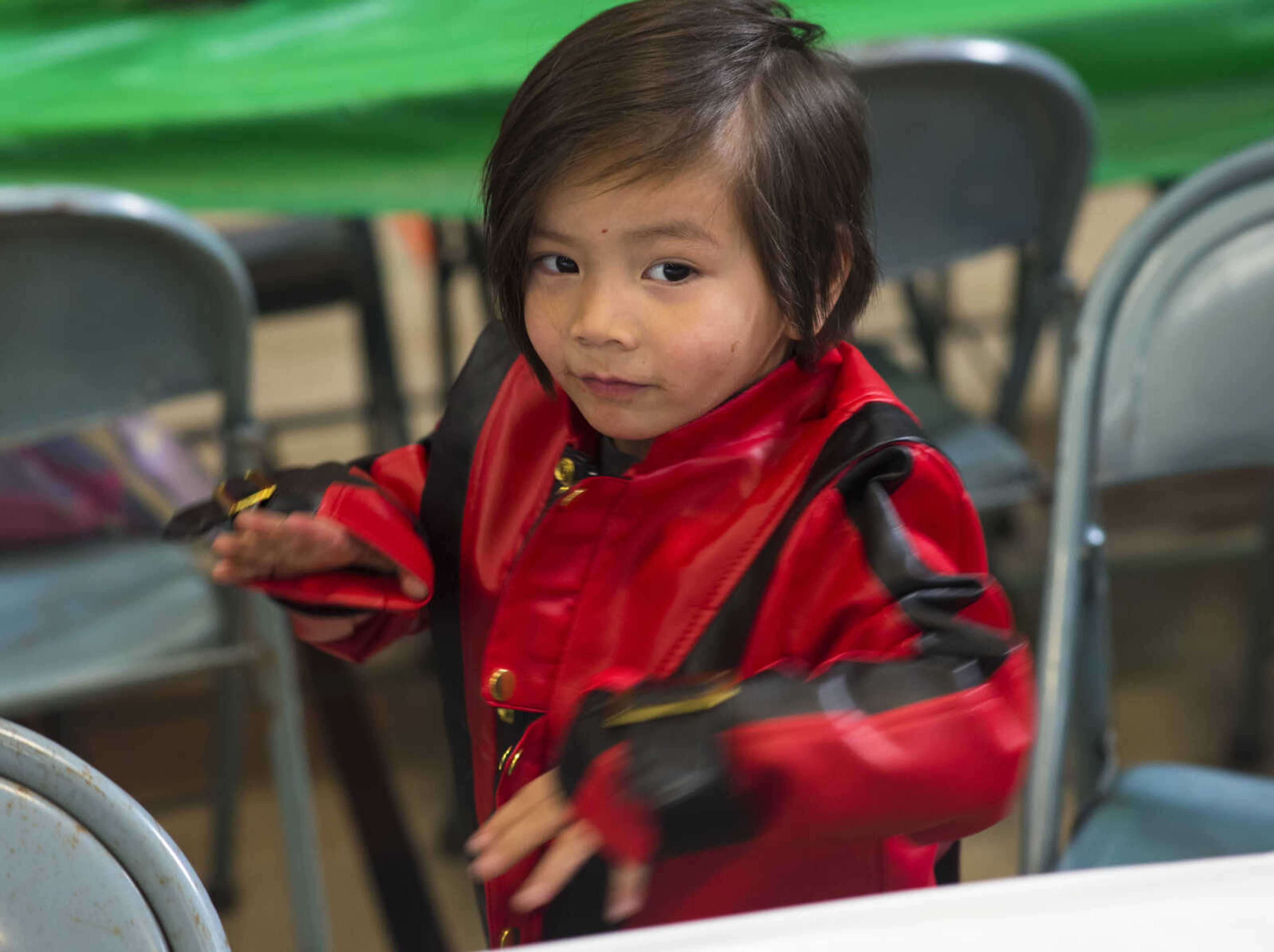 Charlie Seo, 3, shows of his "Thriller" dance after donning a Michael Jackson jacket during a free lunch hosted by Student Santas on Dec. 25, 2017, at Jefferson Elementary School in Cape Girardeau.