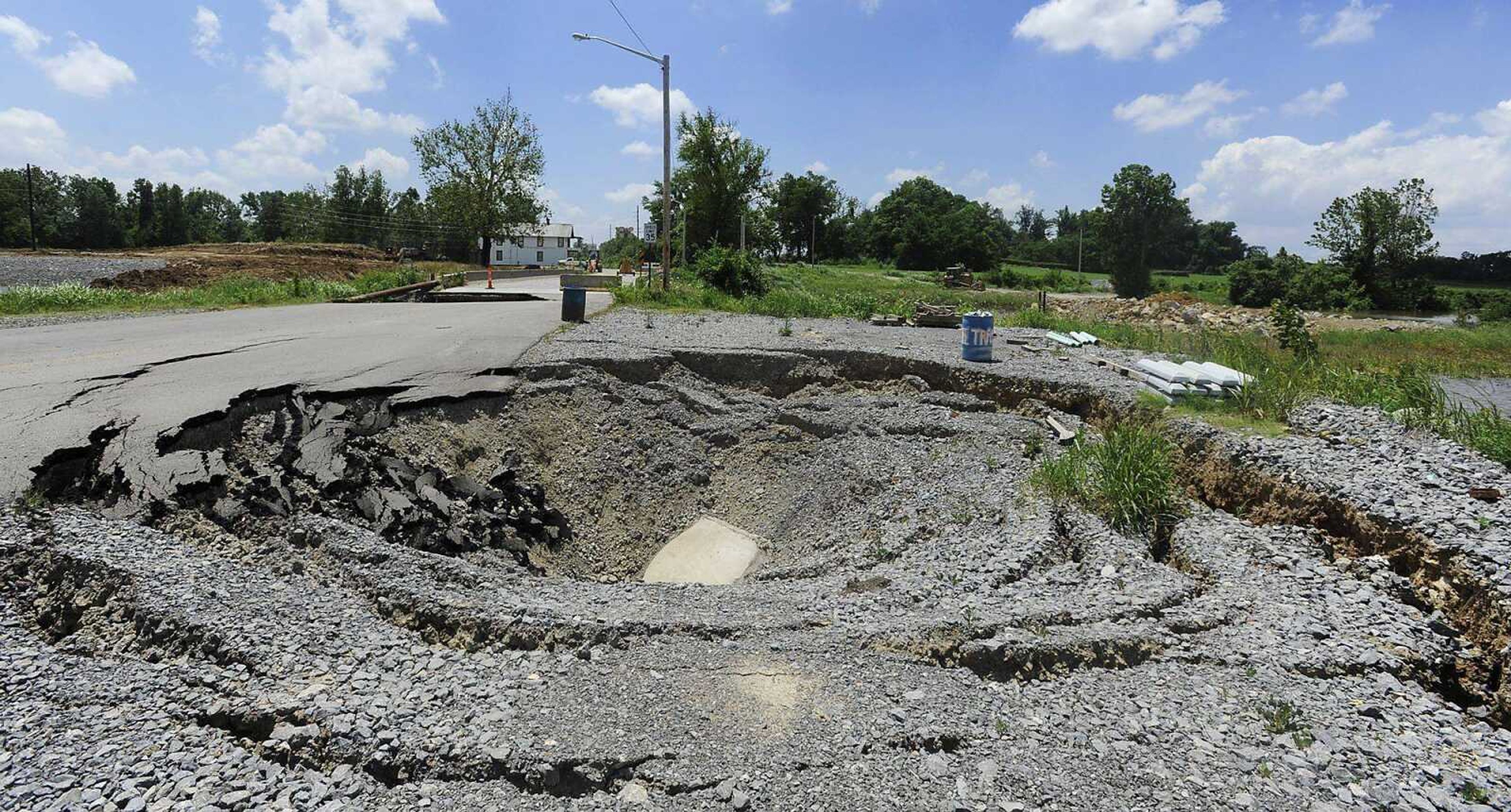 ADAM VOGLER ~ avogler@semissourian.comOne of two sinkholes located in the 2300 block of South Sprigg StreetFriday, June 7, in Cape Girardeau. The sinkholes, which have caused the street to be closed, are getting worse according to Cape Girardeau public service director Tim Gamling.