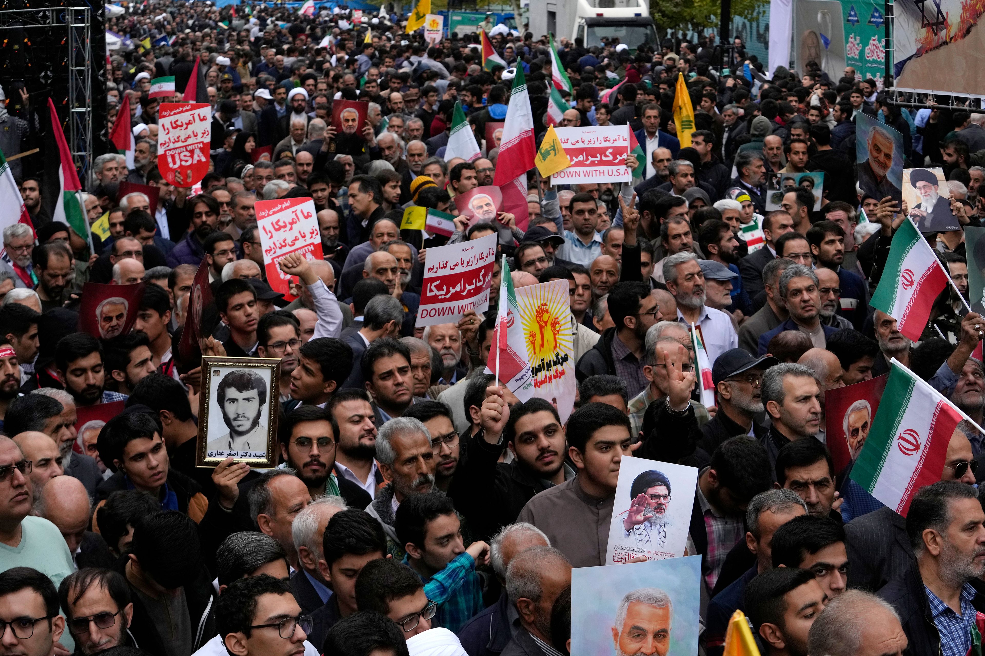 Iranians attend an annual rally in front of the former U.S. Embassy in Tehran, Iran, Sunday, Nov. 3, 2024, marking the 45th anniversary of Iranian students' takeover of the embassy, starting a hostage crisis. (AP Photo/Vahid Salemi)