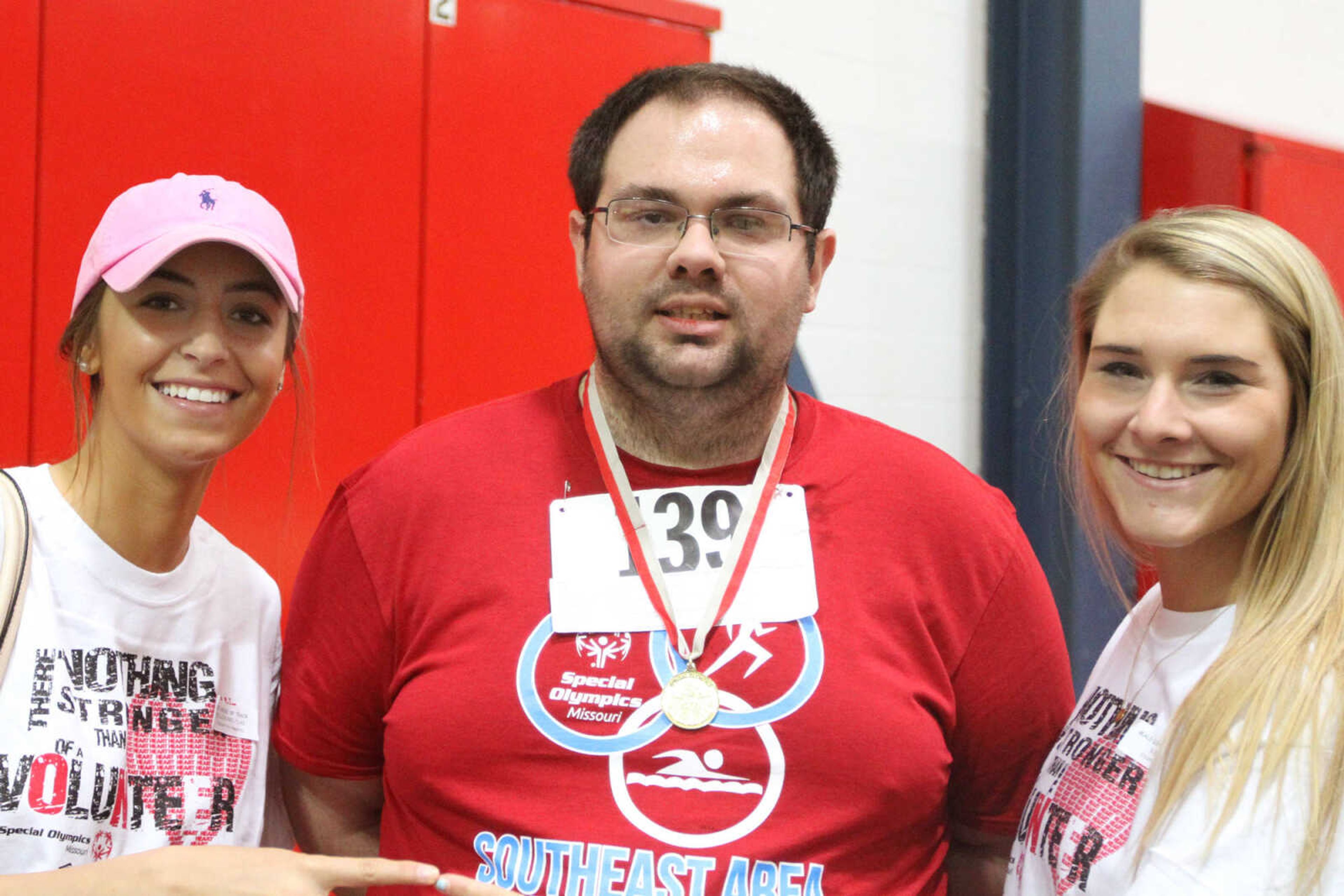 GLENN LANDBERG ~ glandberg@semissourian.com

Loren Foppe, left, Eric Sanders and Kelly Ball pose for a photo during the Missouri Special Olympics Southeast Area Spring Games Saturday, April 11, 2015 at the Student Recreation Center of Southeast Missouri State University.