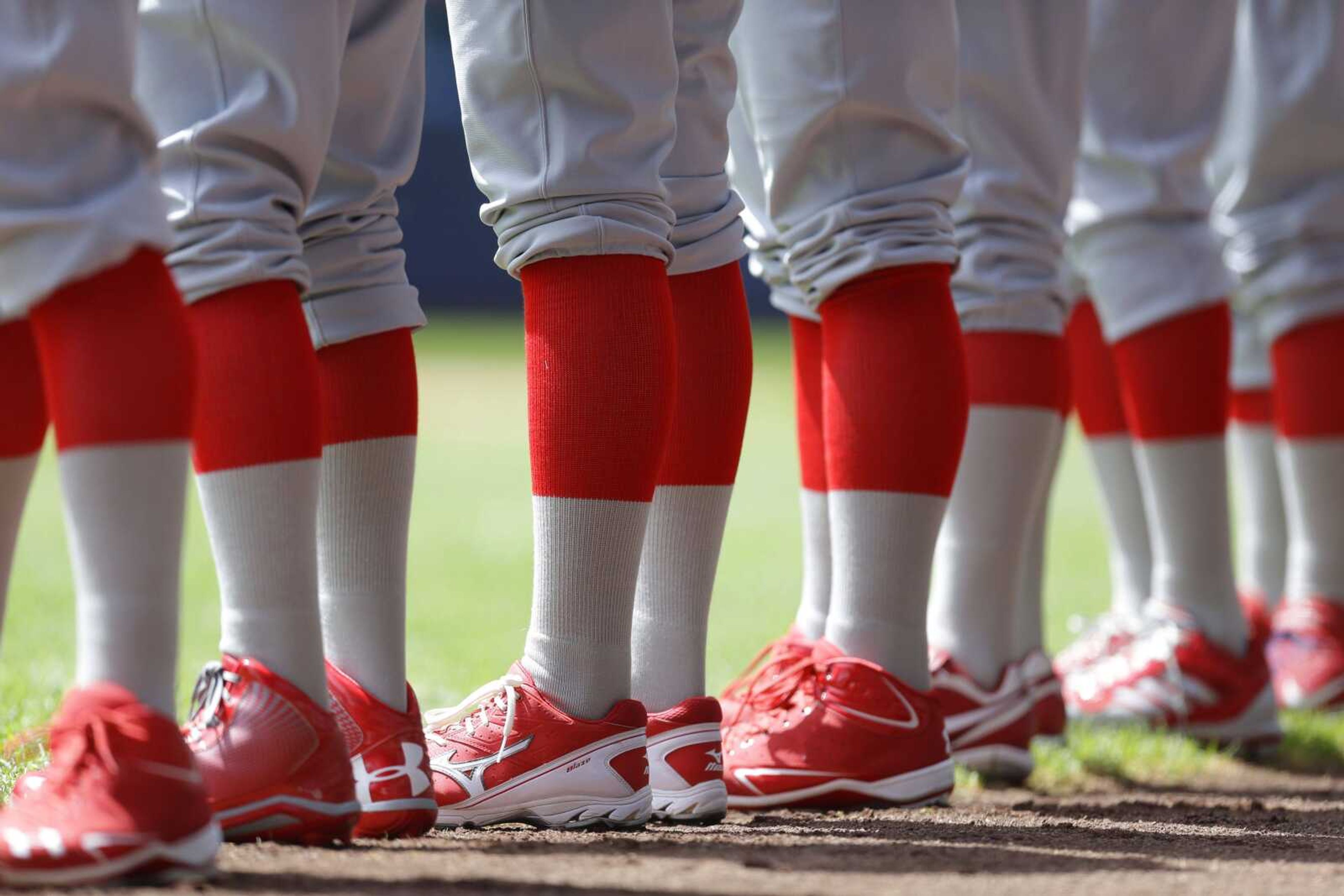 Cardinals players line up for the national anthem before Sunday&#8217;s game. Both teams wore 1913 replica uniforms for the game.