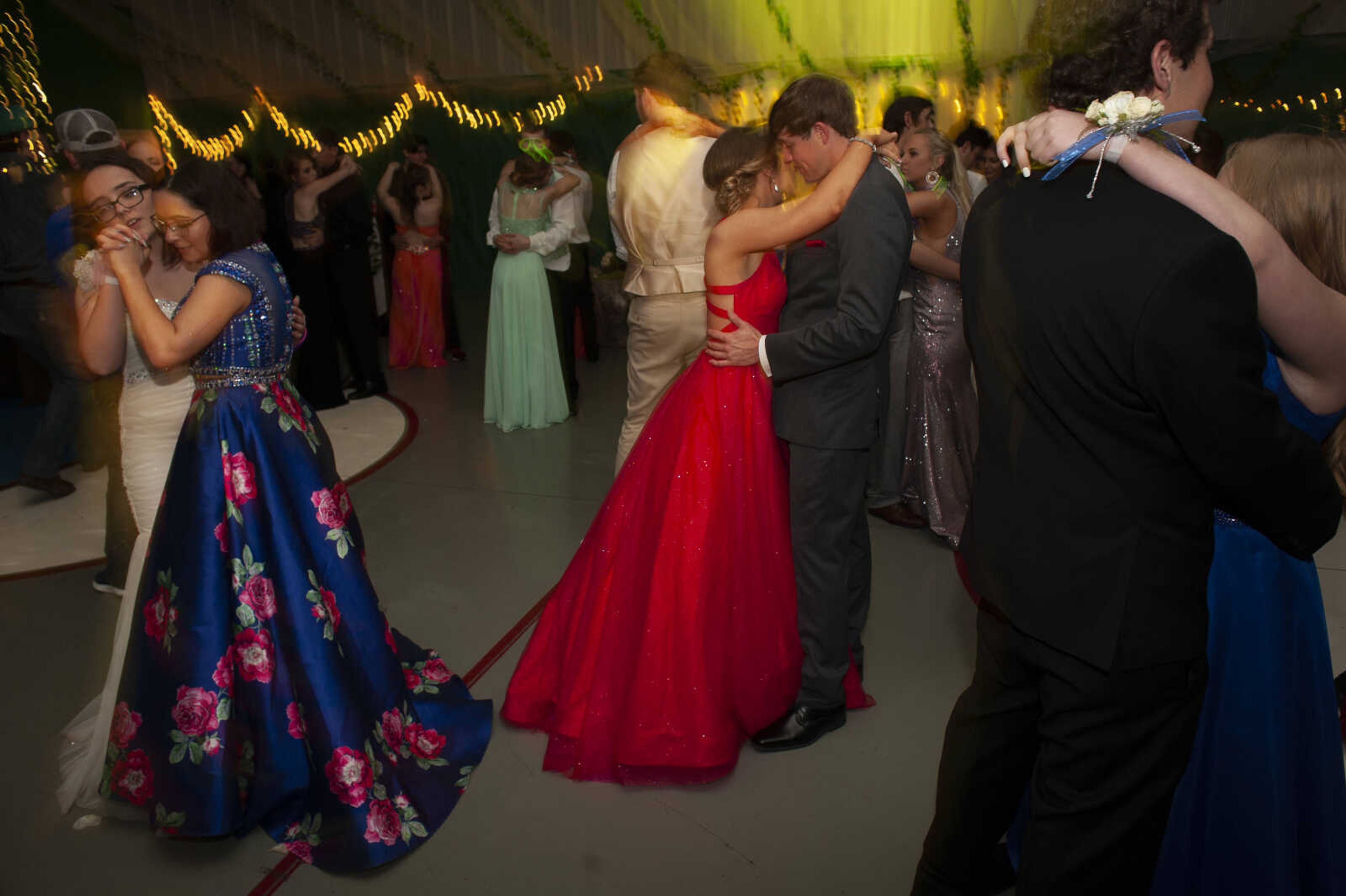 Delta prom king and senior Damon Bartels, right, dances with Notre Dame sophomore Hannah Kelley near Delta junior Prudence Ketcham, left in white, and Cassandra Cortez of Bell City, Missouri, during Delta High School's prom on Saturday, April 13, 2019, at the Delta Community Center.