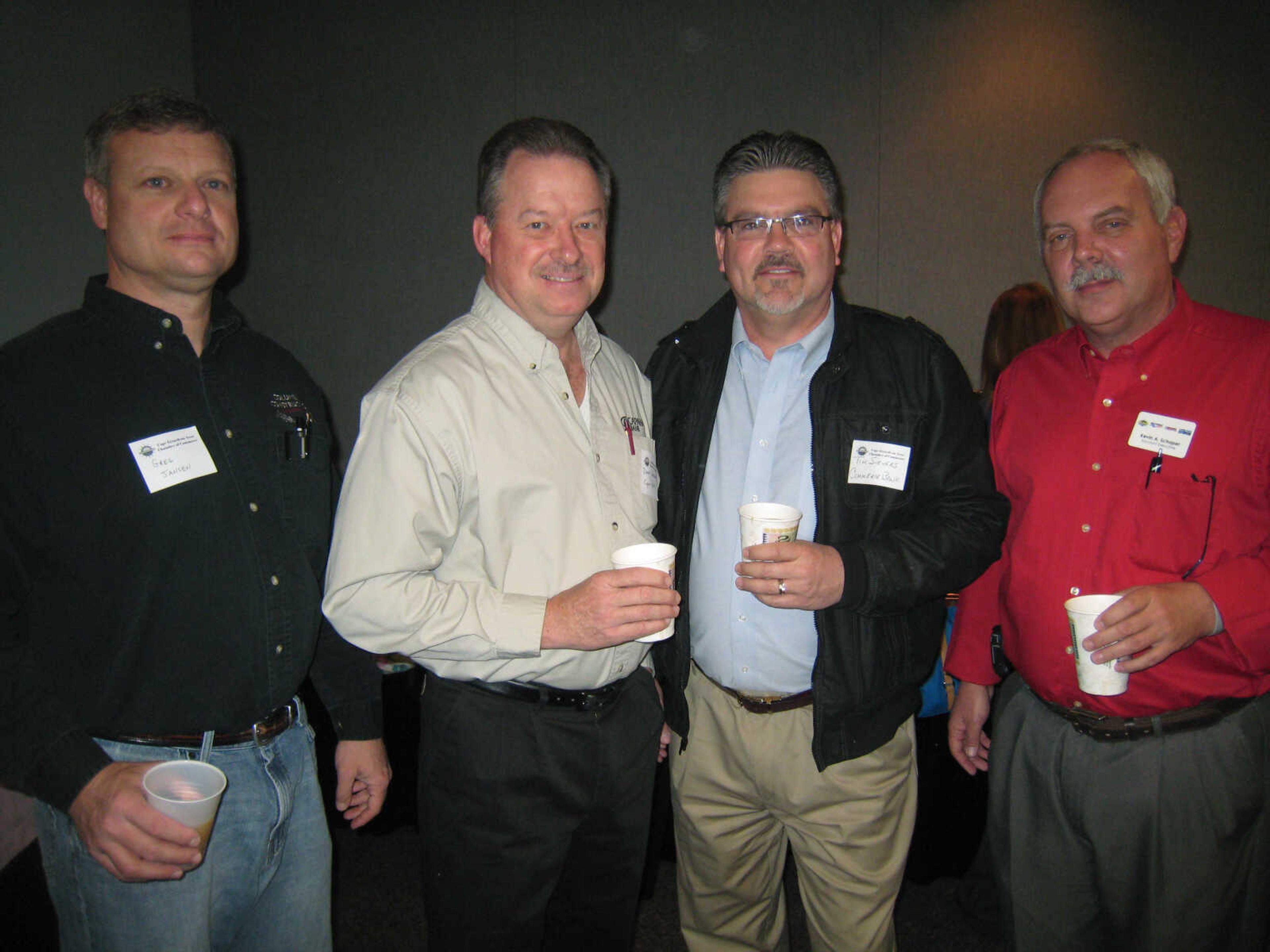 Greg Jansen, left, Columbia Construction; Darrell Aufdenberg, Capaha Bank; Tim Sievers, Commerce Bank; and Kevin Schaper, Withers Broadcasting, pose at the Cape Girardeau Area Chamber of Commerce First Friday Coffee, April 5 at the Show Me Center.