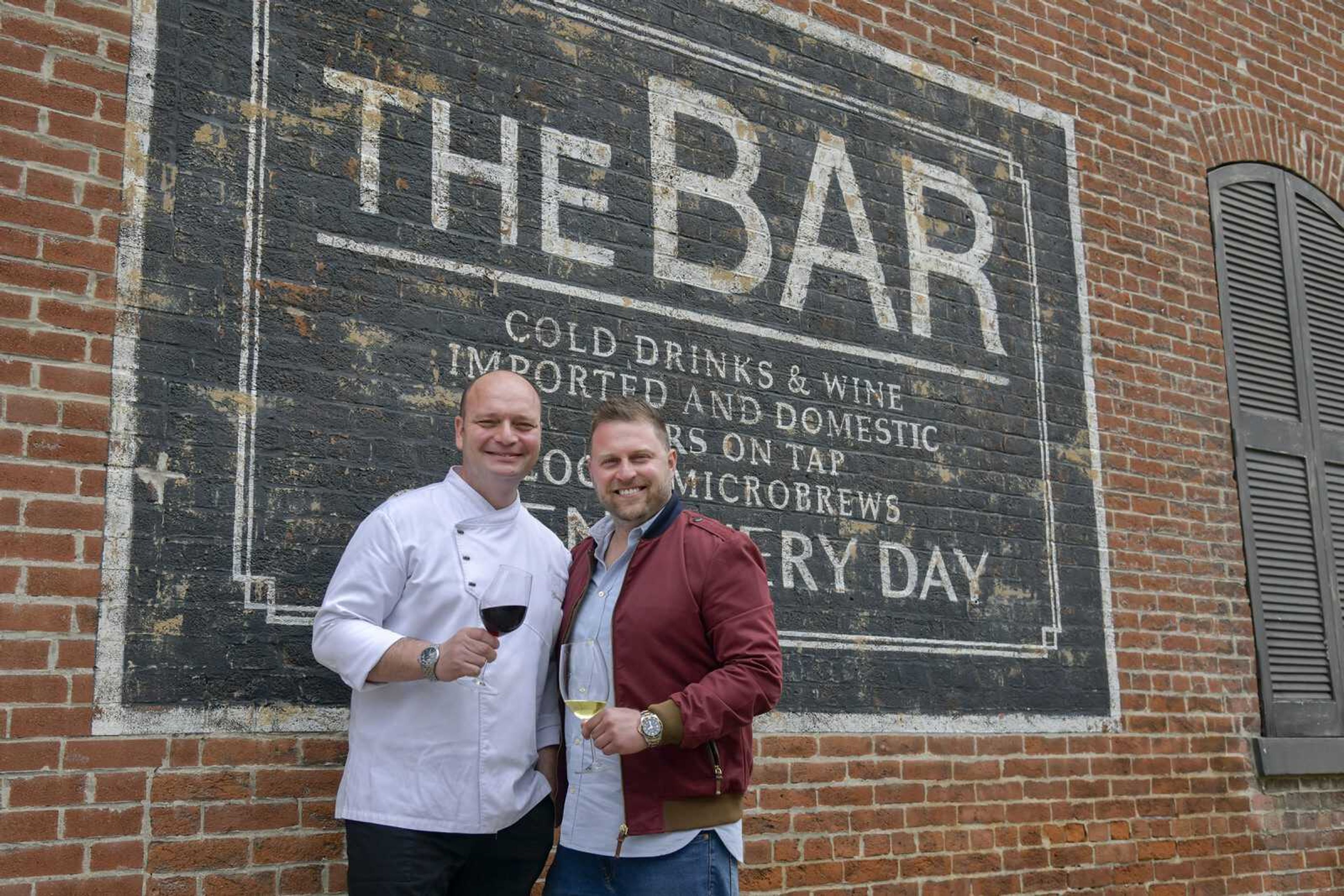 Chef Giannicola Colucci and Gabriele Ruggieri pose for a portrait in front of The Bar, where they plan to open a new restaurant, in Cape Girardeau this month.