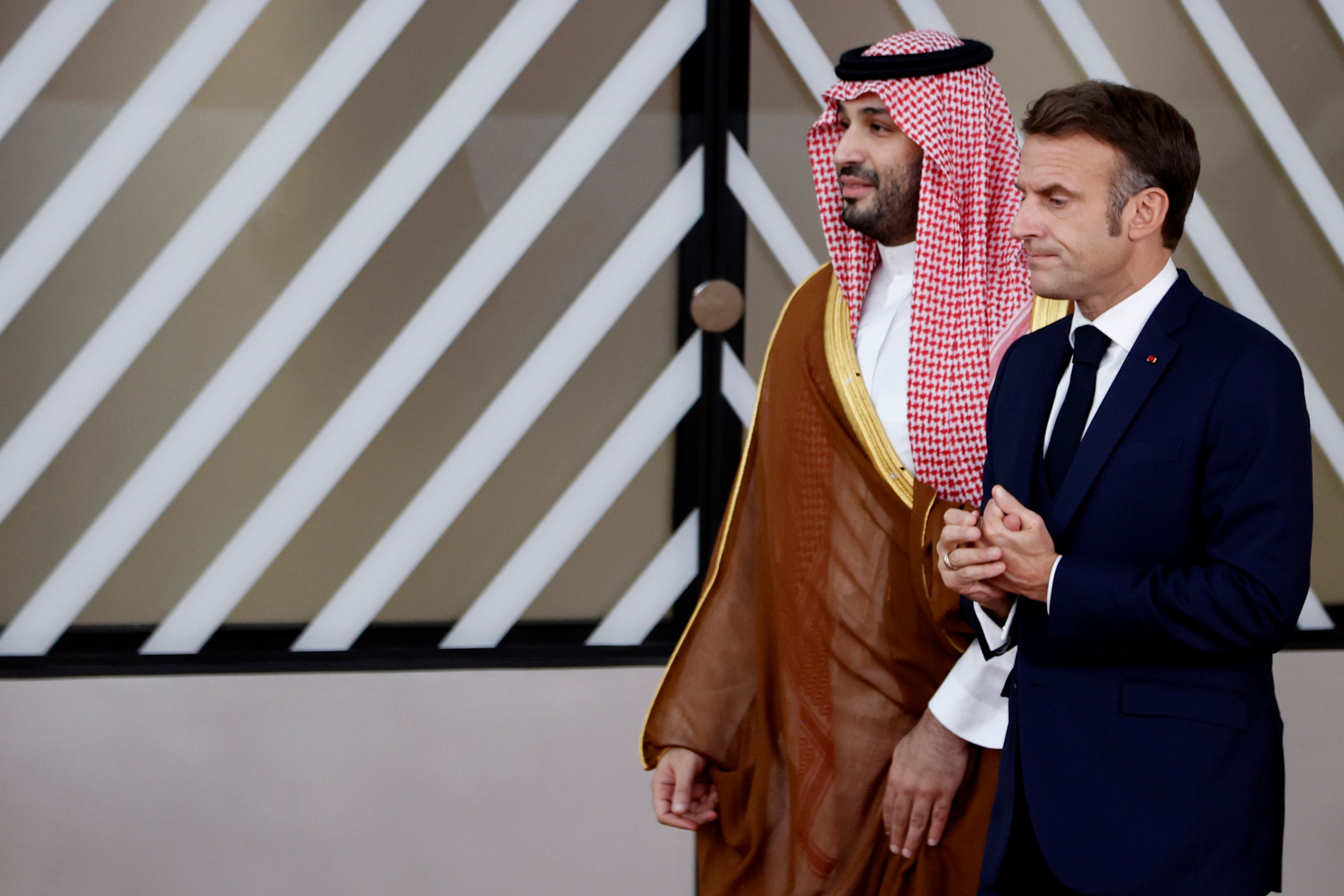 French President Emmanuel Macron, right, speaks with Saudi Arabia's Prime Minister and Crown Prince Mohammed bin Salman bin Abdulaziz Al Saud prior to a group photo at an EU-Gulf Cooperation Council meeting in Brussels, Belgium, Wednesday, Oct. 16, 2024. (AP Photo/Omar Havana)