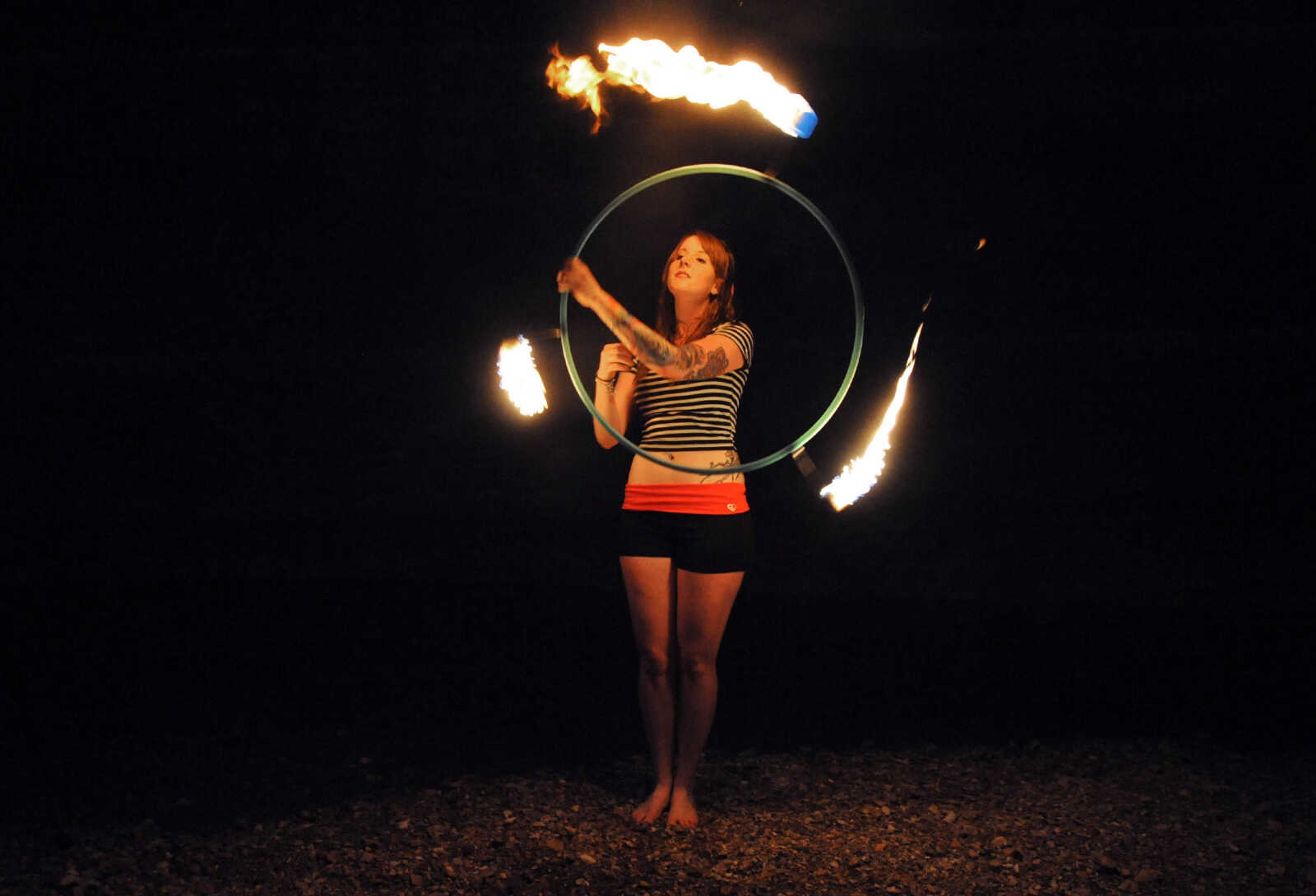 LAURA SIMON ~ lsimon@semissourian.com

Chelsie Welker fire hoops in a Cape Girardeau County creek, Tuesday, May 26, 2015.