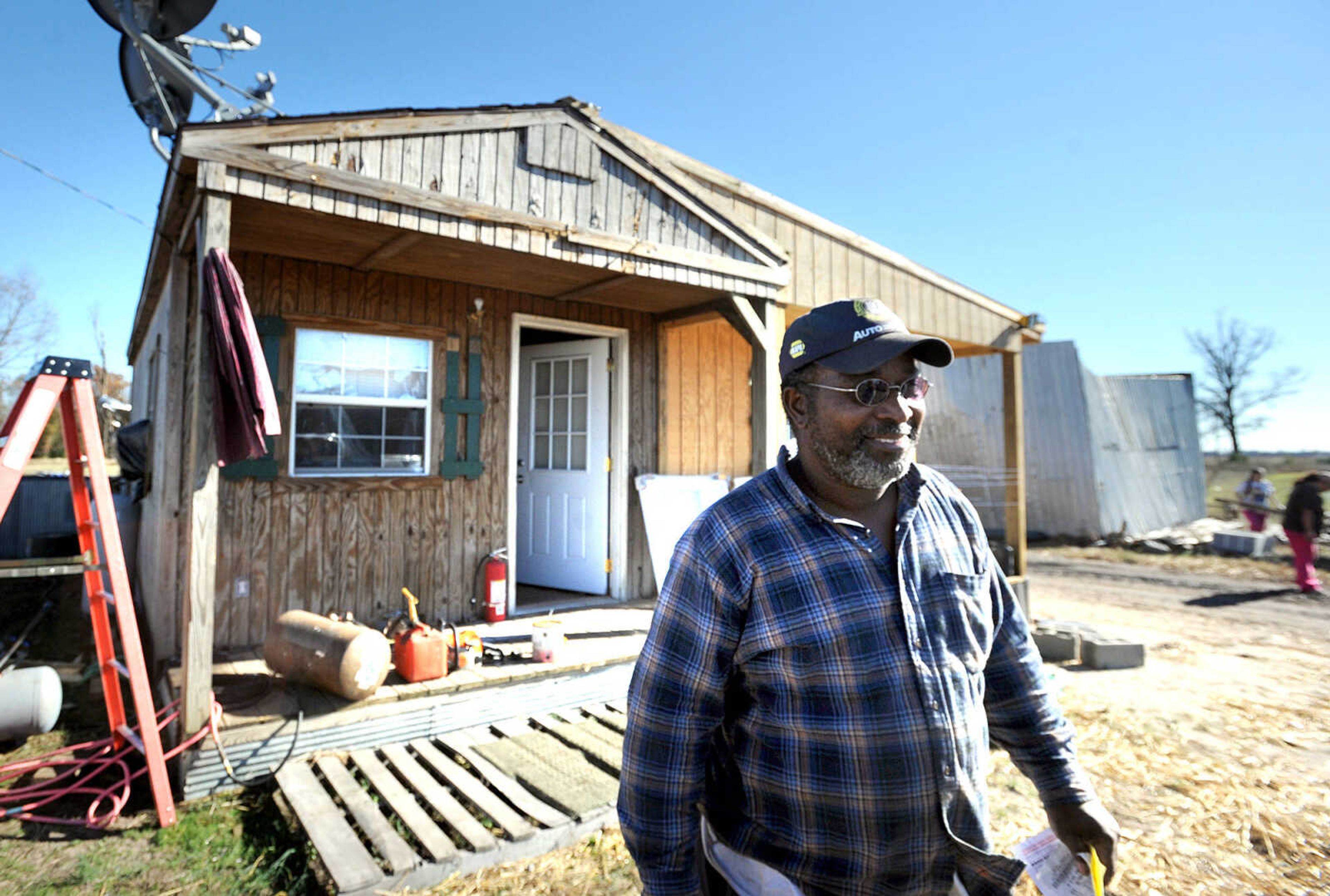 LAURA SIMON ~ lsimon@semissourian.com

Dean Miles stands in front of his Morley, Mo. office, Monday, Nov. 18, 2013. Miles road out Sunday's storms by laying face-down on the ground in front of his office, sheltering his head with his hands.