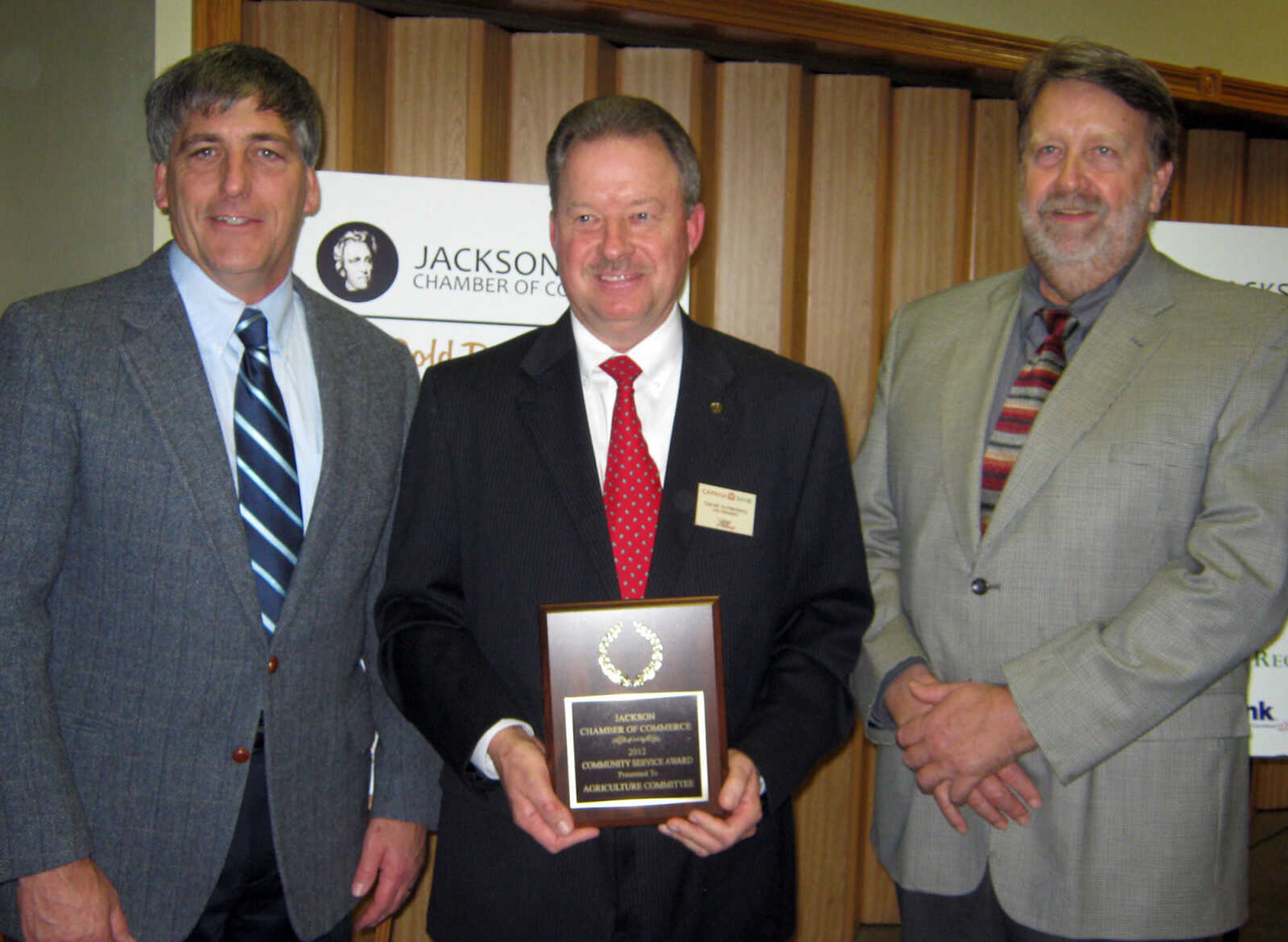 George Kirchendorfer, left, Darrell Aufdenburg and David Wells receive the Community Service Award for the Agriculture Committee, Jan. 11, at the Jackson Area Chamber of Commerce annual awards banquet at the Knights of Columbus Hall in Jackson, Mo. Committee members not pictured: Roger Eakins, Dean Sawyer.