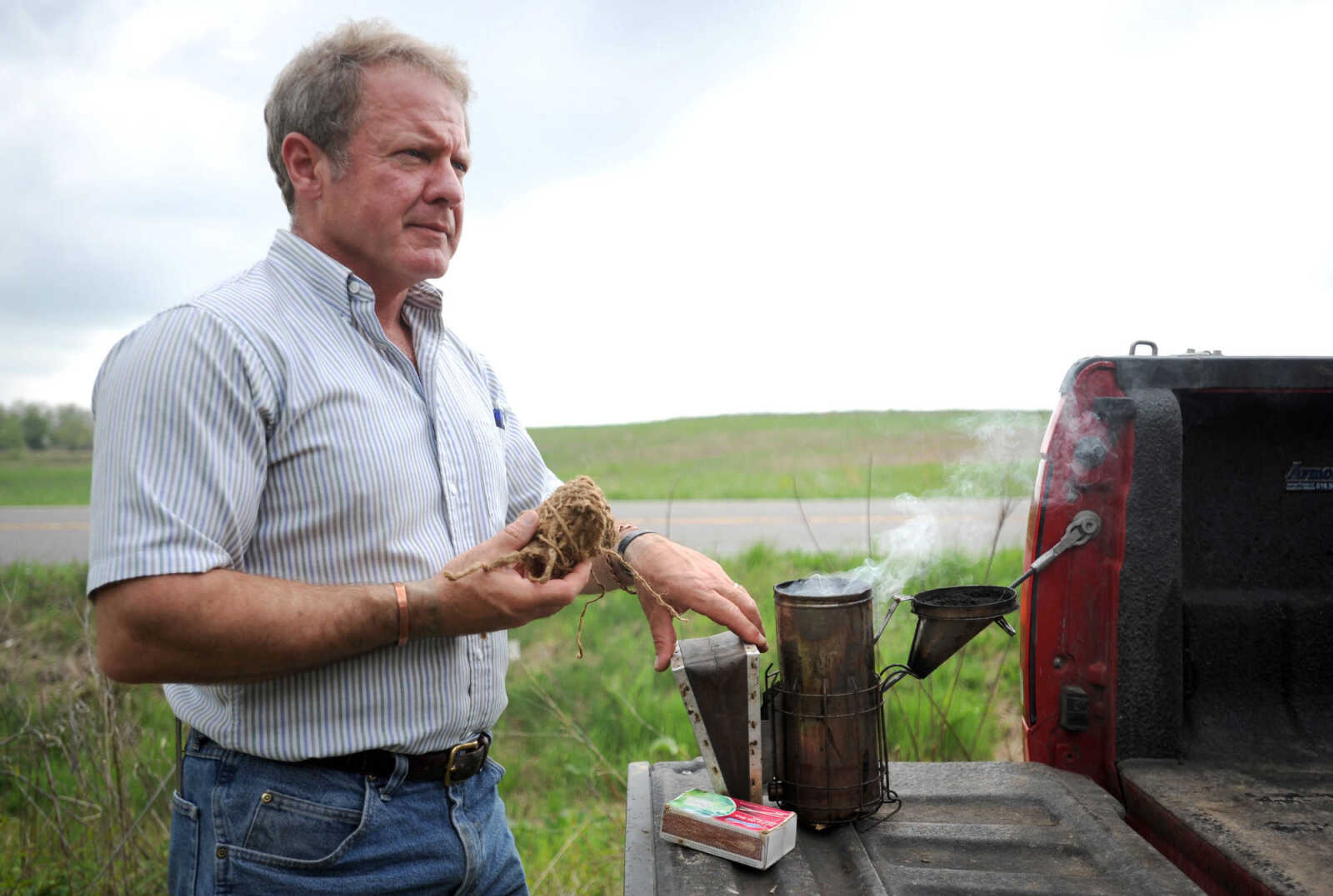 LAURA SIMON ~ lsimon@semissourian.com

Grant Gilliard checks on his beehives in Cape Girardeau County.