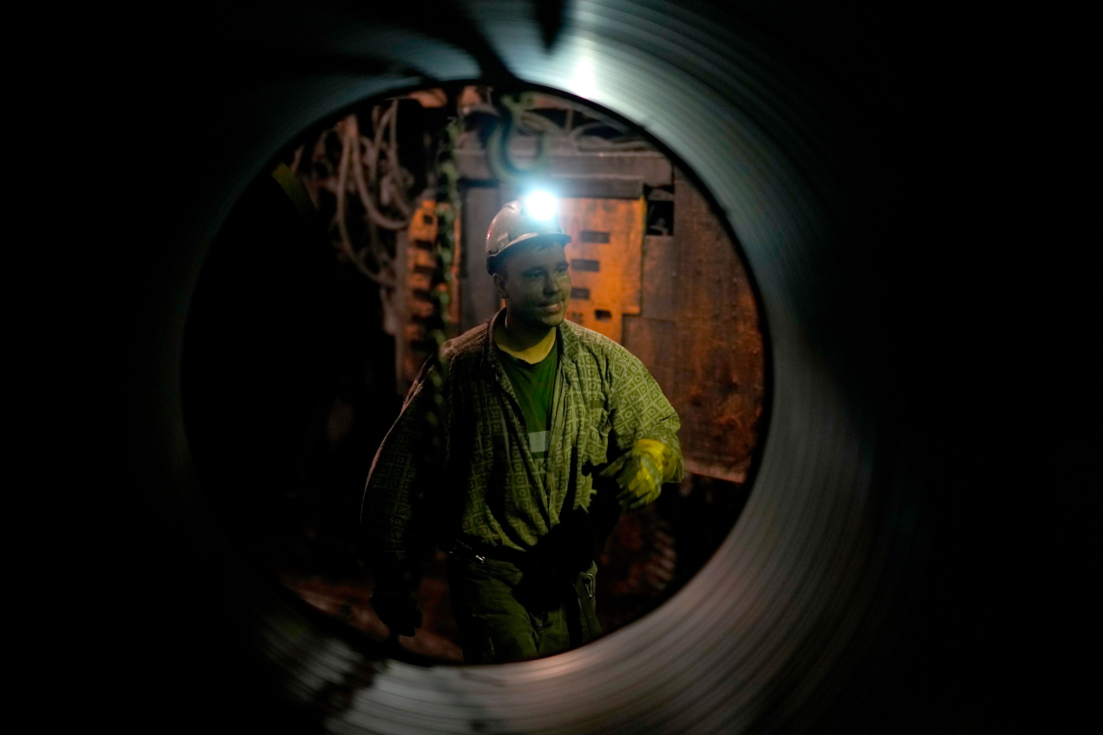 A miner walks in a shaft of the CSM coal mine in Stonava, Czech Republic, Monday, Oct. 14, 2024. (AP Photo/Petr David Josek)