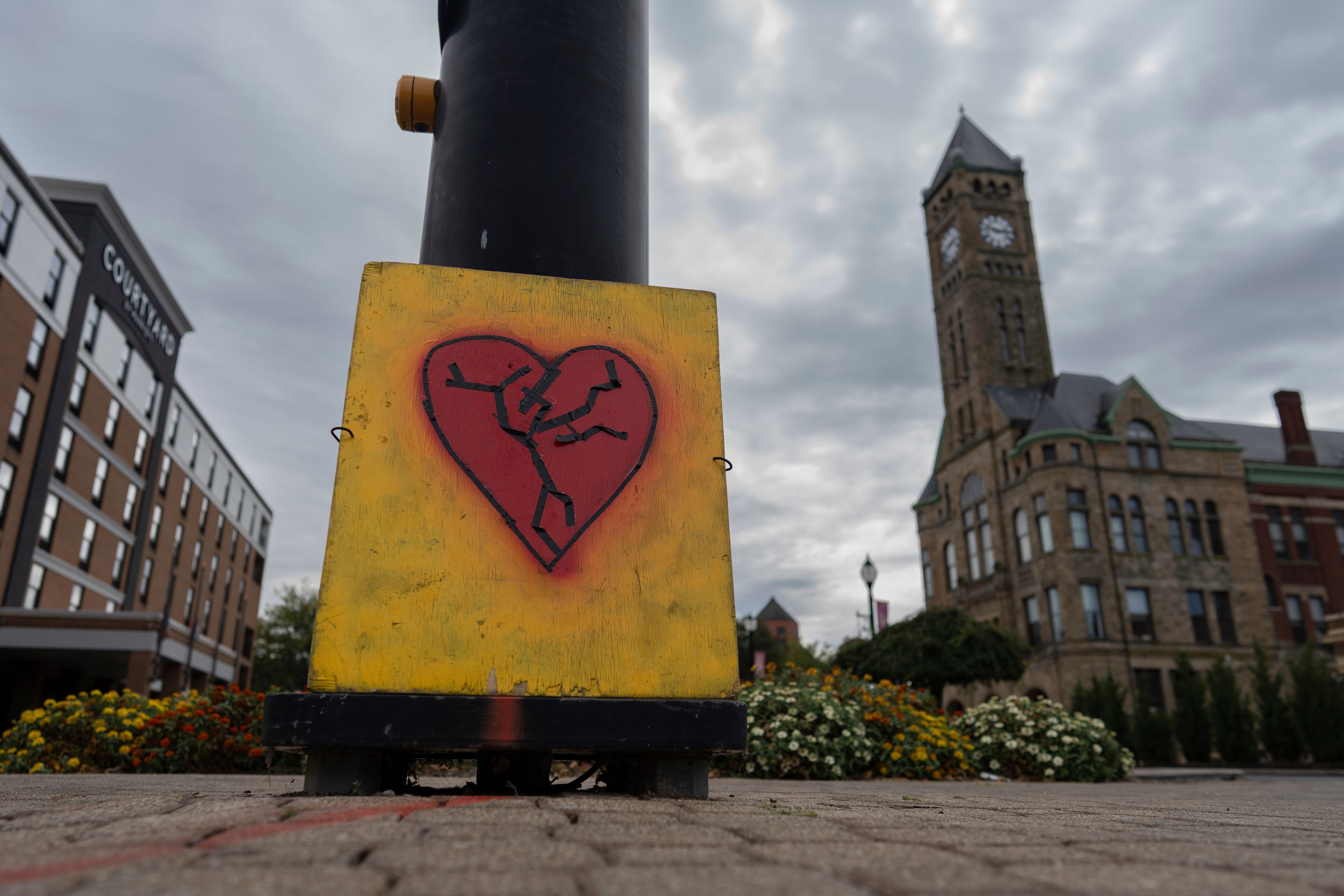 An image of a broken heart is fixed across the street from City Hall with the Heritage Center of Clark County, right, Tuesday, Sept. 17, 2024, in Springfield, Ohio. (AP Photo/Carolyn Kaster)