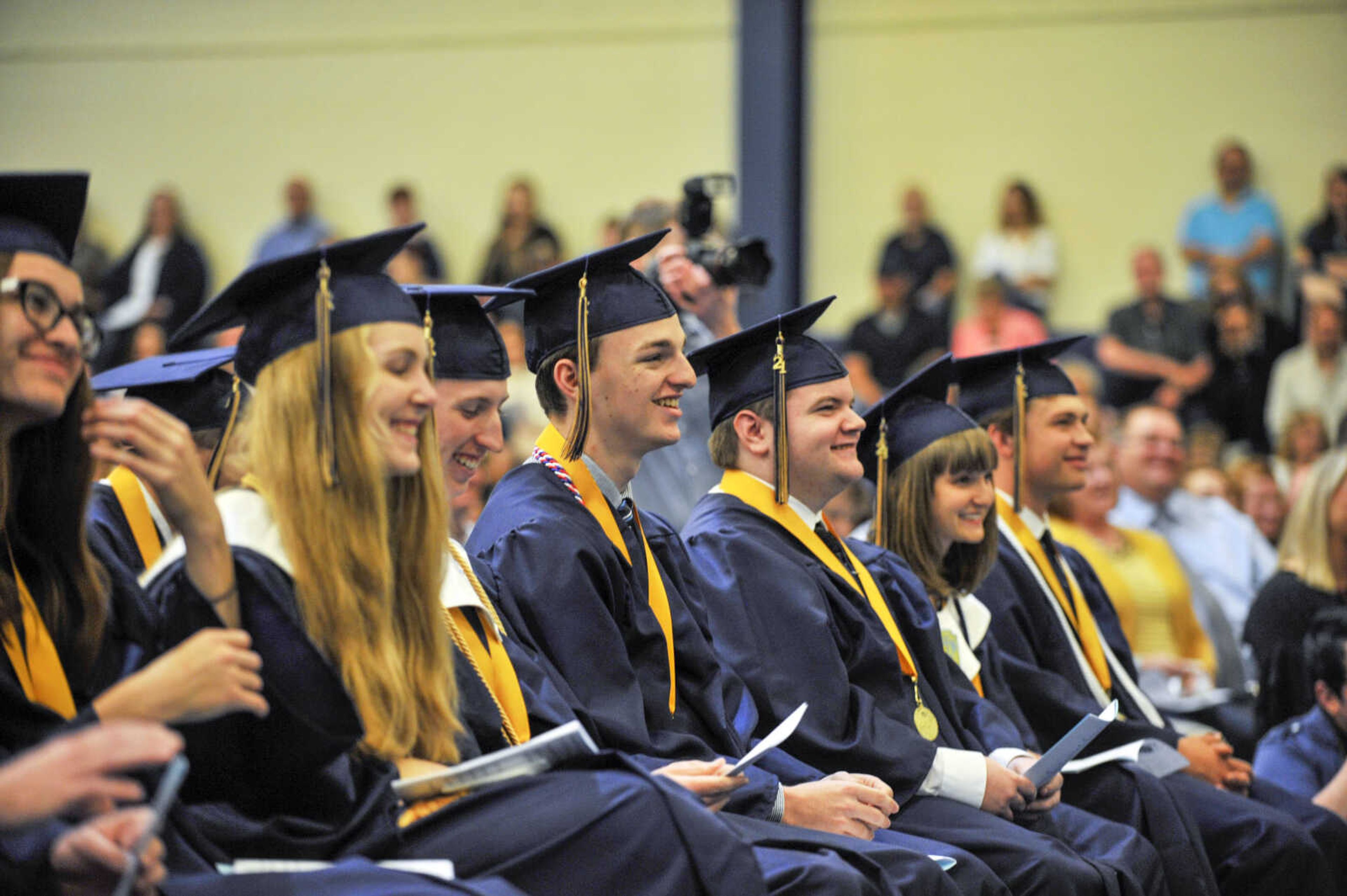 Graduates laugh during a class address speech by Brock Engert during commencement at Saxony Lutheran High School on Sunday, May 16, 2021.