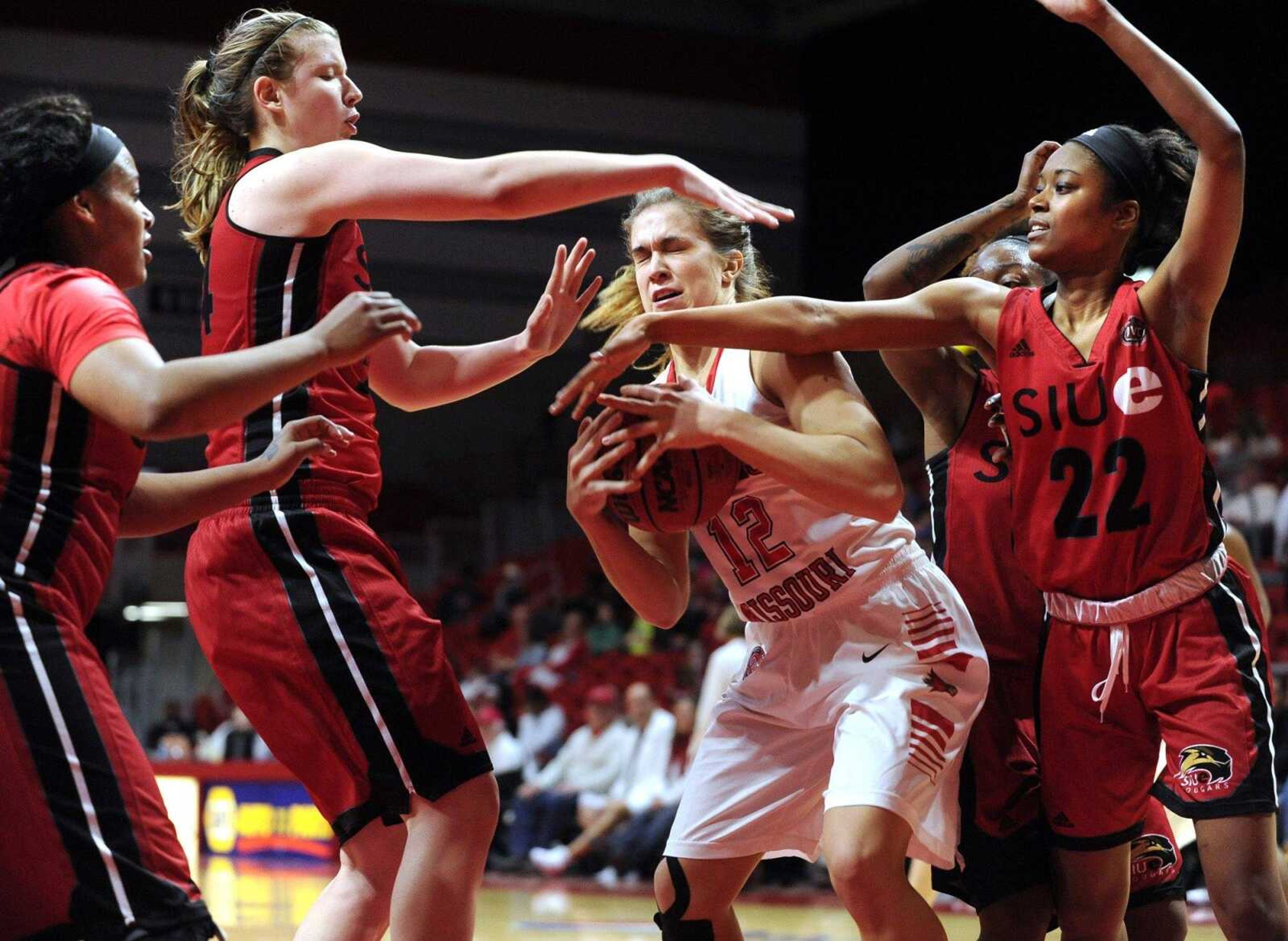 Southeast Missouri State's Erin Bollmann grabs a rebound away from SIUE's Shronda Butts, left, Sydney Bauman and Amri Wilder during the fourth quarter Wednesday, Feb. 24, 2016 at the Show Me Center.