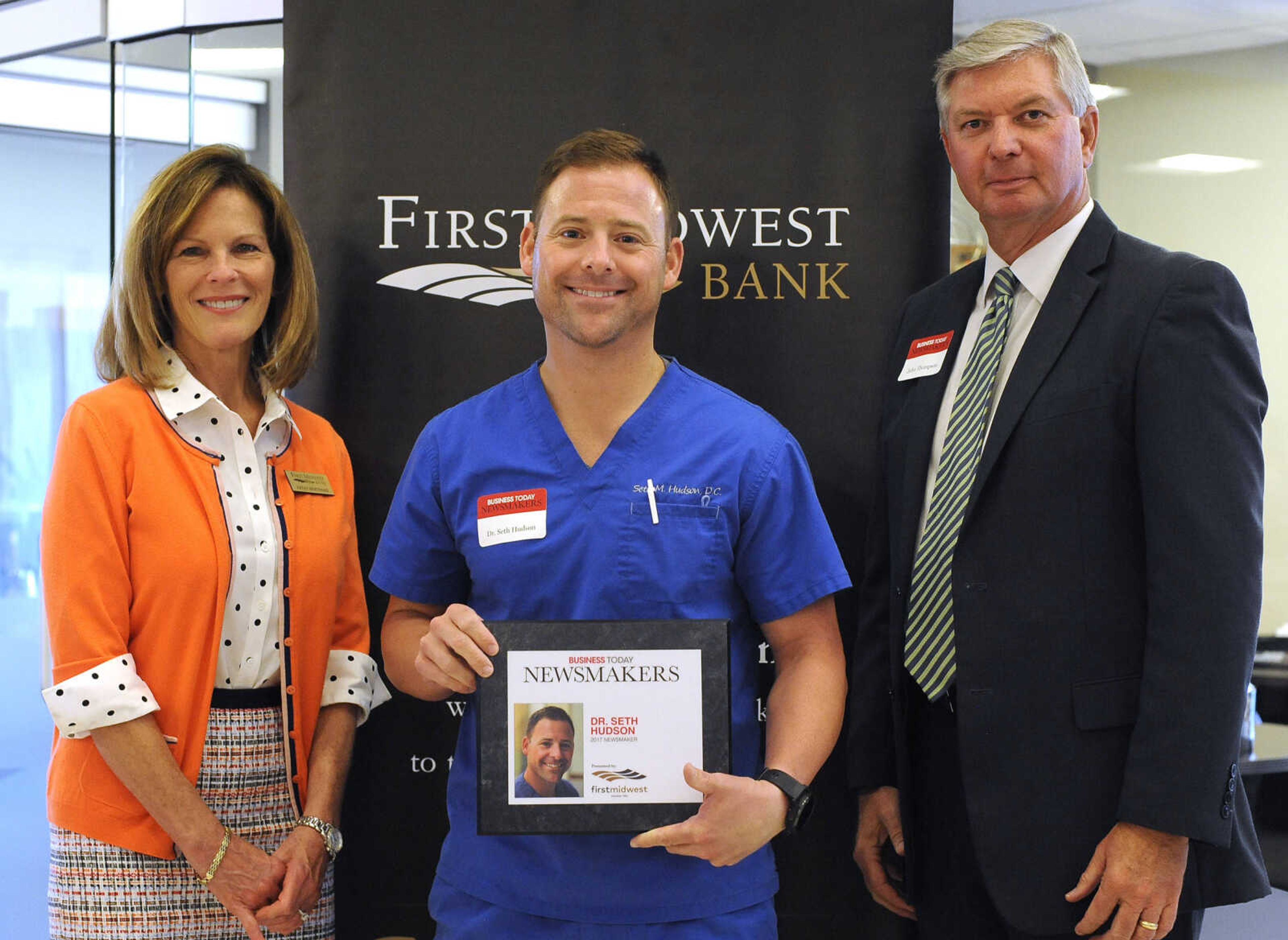 FRED LYNCH ~ flynch@semissourian.com
Dr. Seth Hudson poses for a photo with Kathy Bertrand, First Midwest Bank community bank president, Cape Girardeau, and John N. Thompson, First Midwest Bank community bank president, Jackson, Wednesday, Sept. 6, 2017 during the Business Today Newsmakers awards reception at First Midwest Bank in Cape Girardeau.