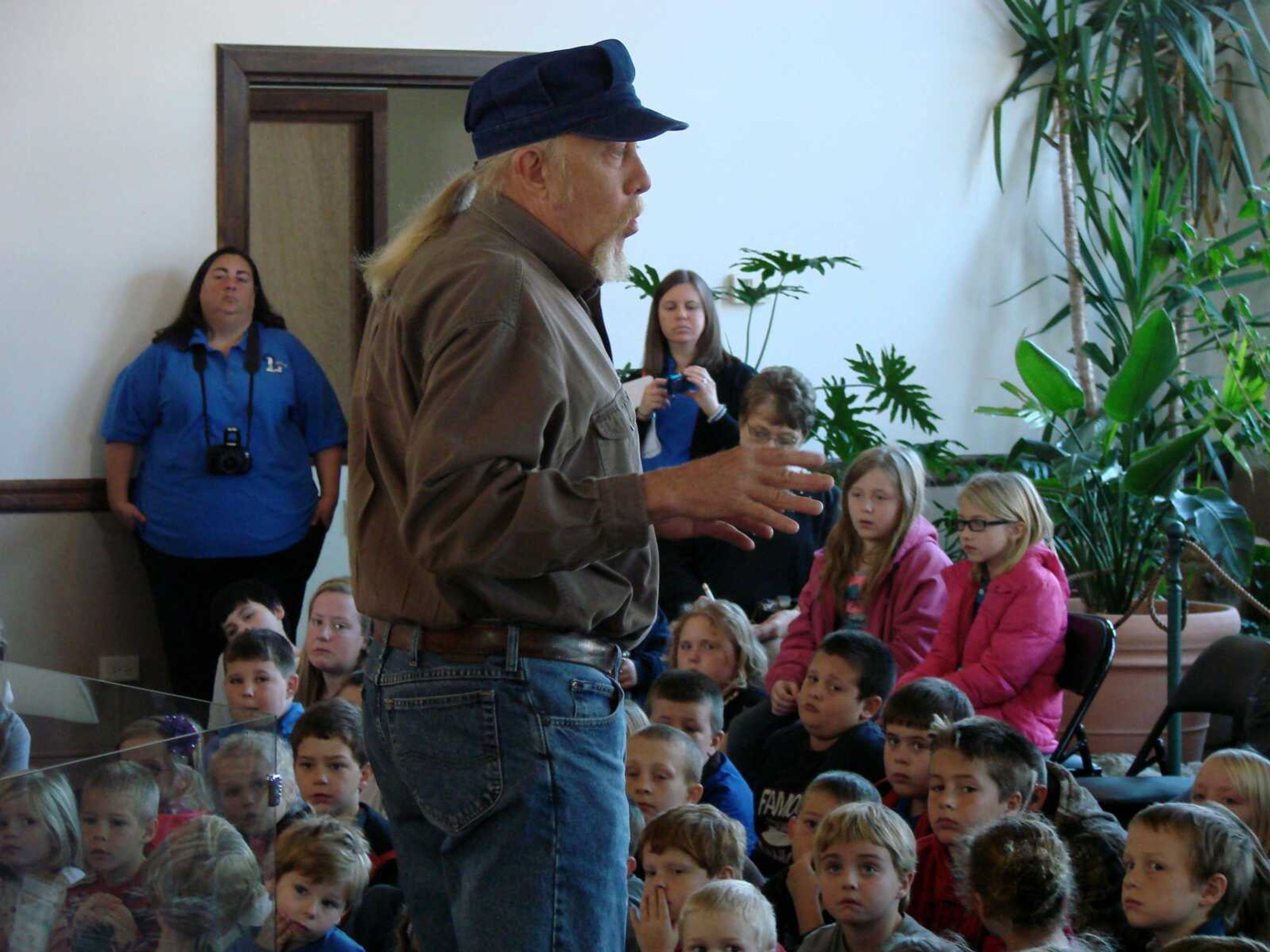 Guy Darrough talks to the students gathered at a 2012 naming ceremony about the importance of the Missouri dinosaur.