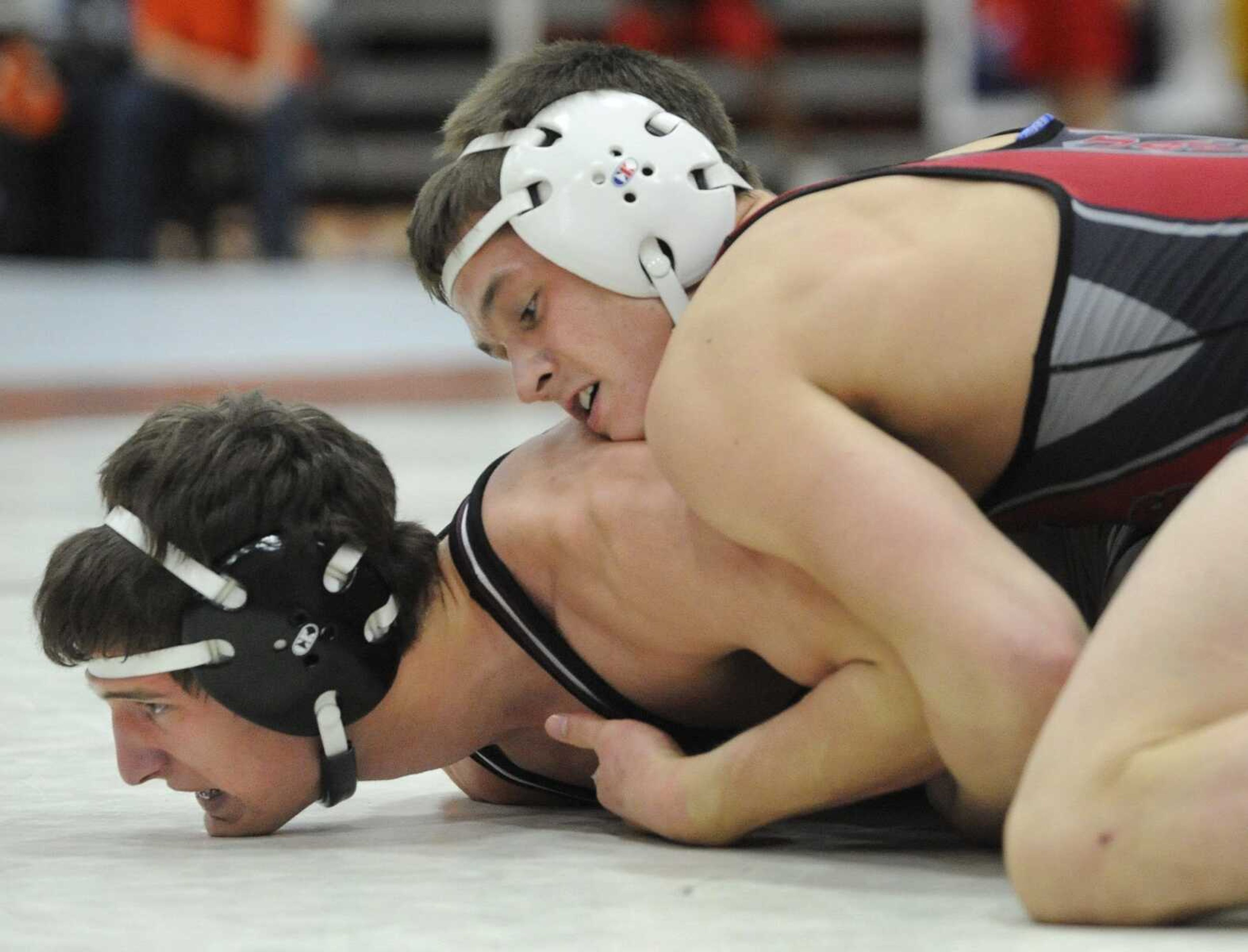 Jackson's Jacob Colyott has the advantage over Rockwood Summit's Mitch Mays in their 152-pound championship match Saturday.