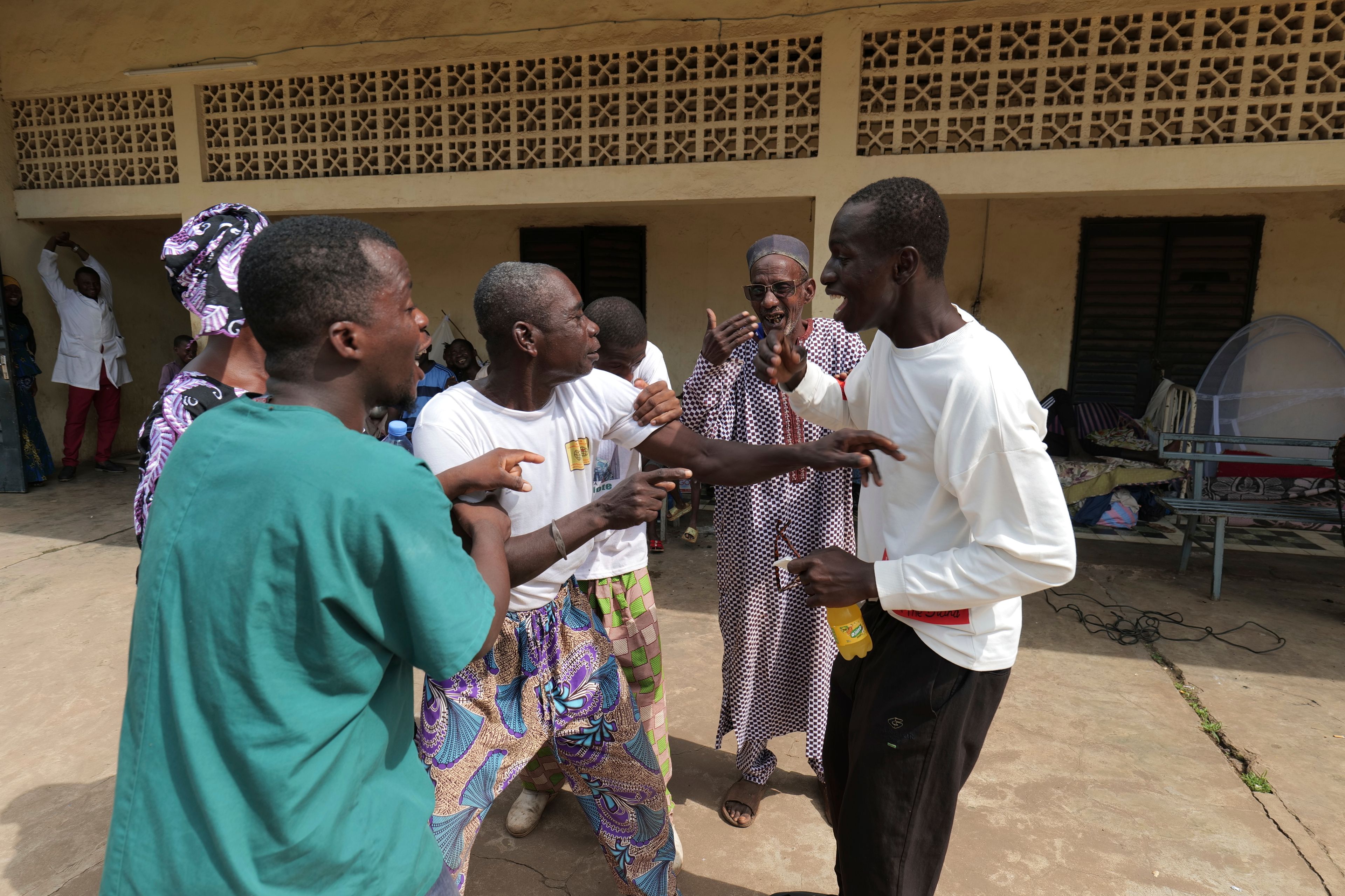 Patients at Bamako's Point G psychiatric ward act out scenes at the psychiatric ward of the Point G hospital in Bamako, Mali, Friday, Sept. 20, 2024. (AP Photo/Moustapha Diallo)