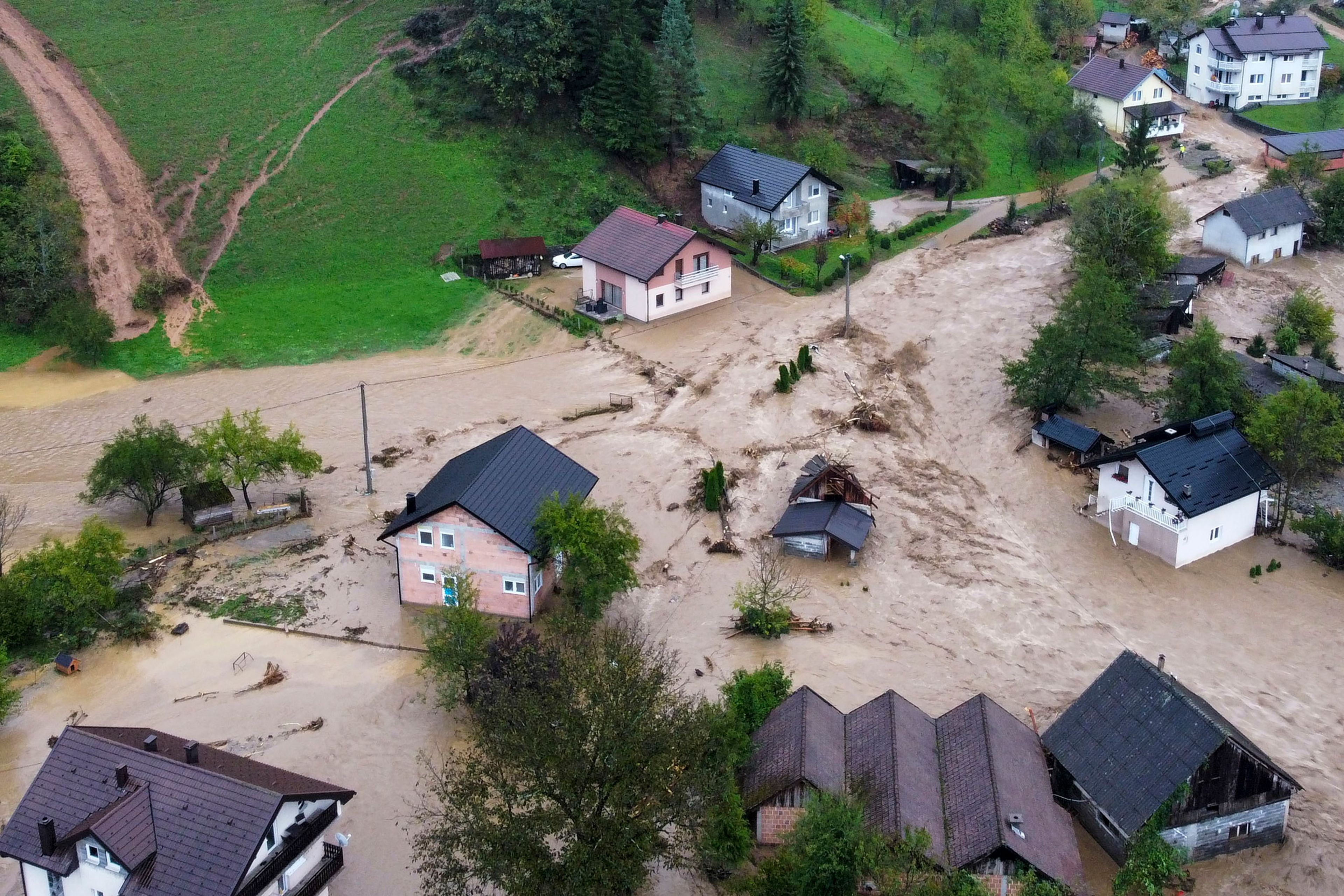 Flooded houses is seen after a heavy rain in the village of Luke, near Bosnian town of Fojnica , 50 kilometers (31 miles) west of Sarajevo, Bosnia, Friday, Oct. 4, 2024. (AP Photo/Robert Oroz)