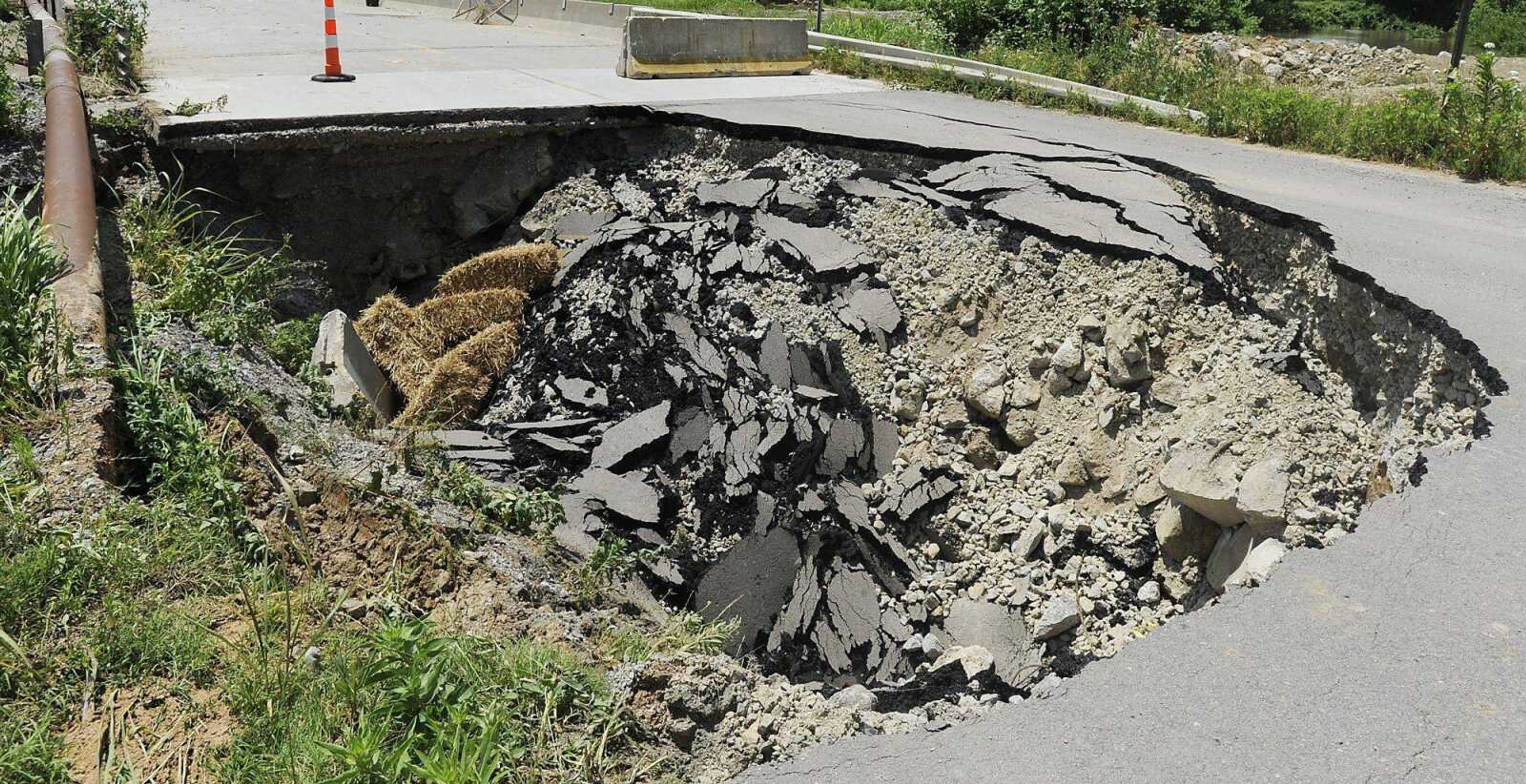 ADAM VOGLER ~ avogler@semissourian.com<br>One of two sinkholes located in the 2300 block of South Sprigg Street<br>Friday, June 7, in Cape Girardeau. The sinkholes, which have caused the street to be closed, are getting worse according to Cape Girardeau public service director Tim Gamling.