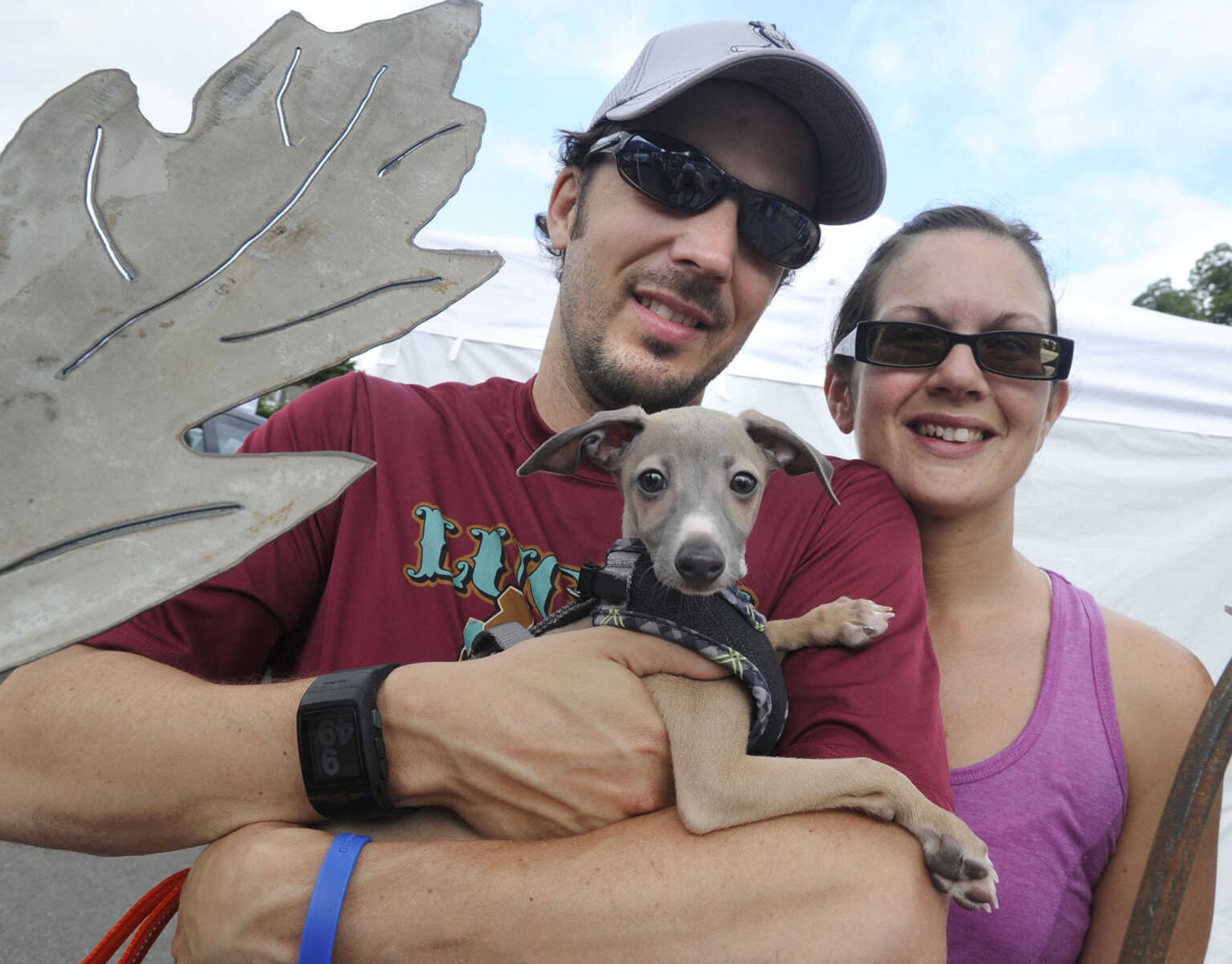 David and Laura Pepon of Cape Girardeau pose for a photo with Grady, their Italian greyhound, at the Cape Riverfront Market on Saturday, July 6, 2013 in Cape Girardeau.