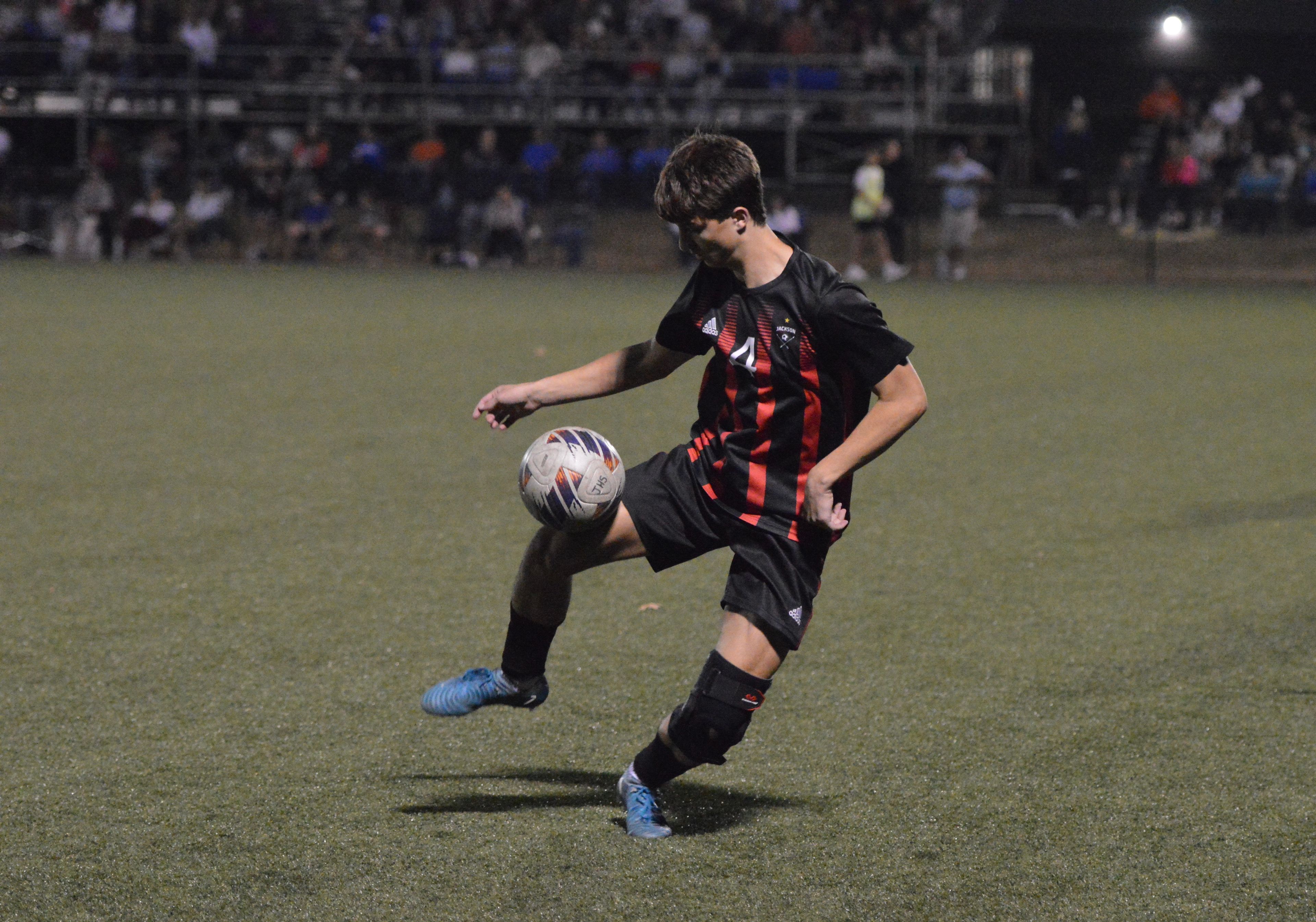 Jackson senior Jake Johnson dribbles the ball against Notre Dame on Tuesday, Oct. 29.