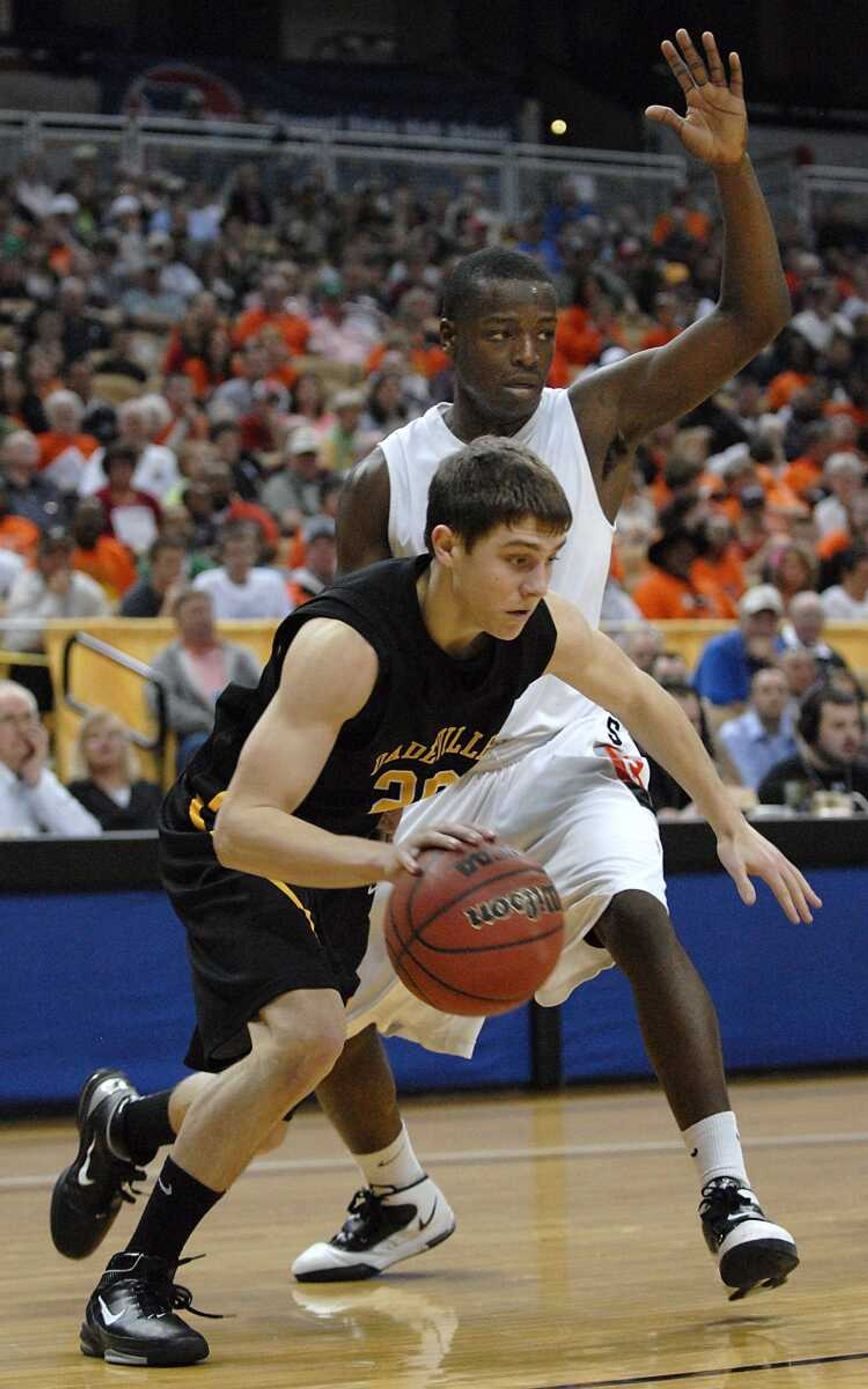 Scott County Central's Lawrence Woodson defends Dade-ville's Trenton Bergmann during the fourth quarter of the Class 1 championship game Saturday in Columbia, Mo.