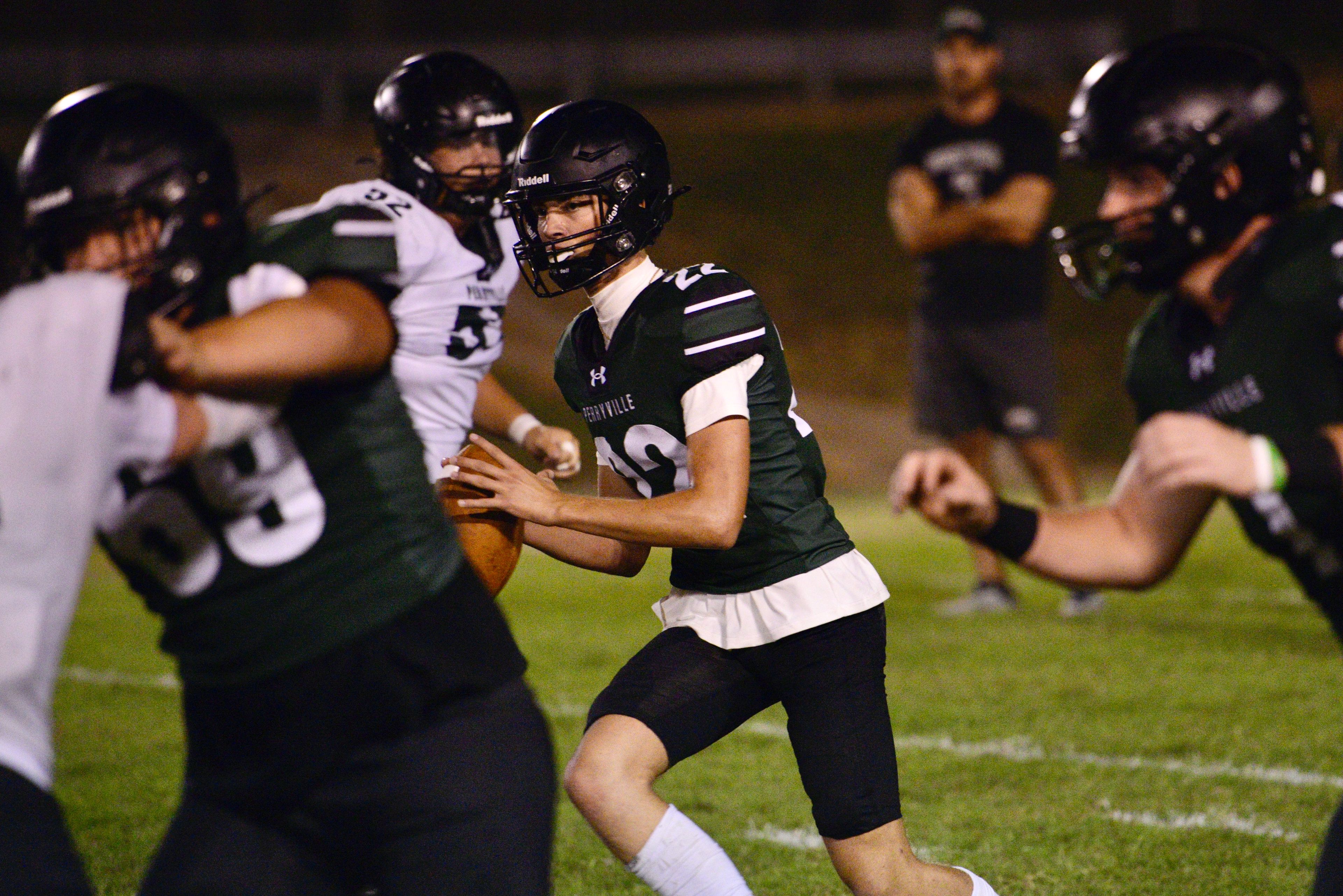 Perryville quarterback Evan Hayden moves around the pocket during the Midnight Game on Saturday, Aug. 17, at Perryville High School.